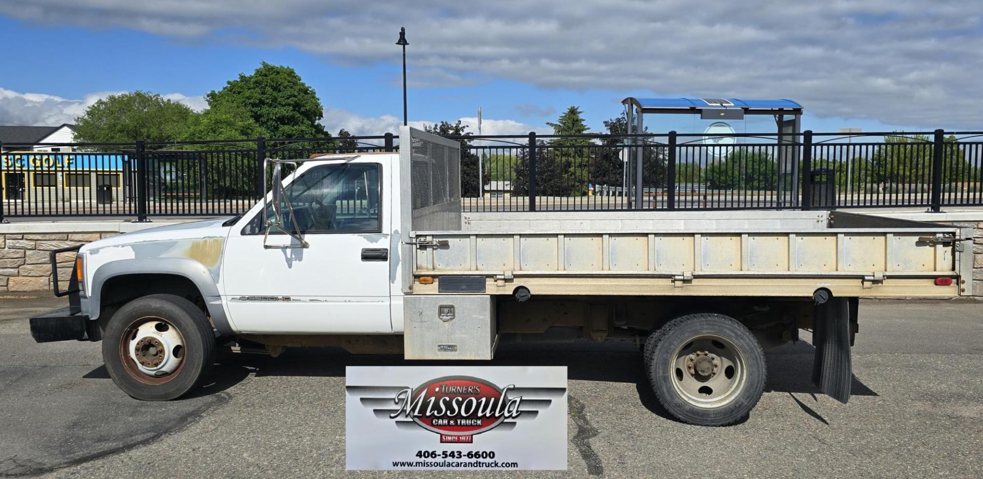 2000 White /Blue Chevrolet C/K 3500 Reg. Cab 2WD (1GBKC34J4YF) with an 7.4L V8 OHV 16V engine, Automatic transmission, located at 450 N Russell, Missoula, MT, 59801, (406) 543-6600, 46.874496, -114.017433 - Beefy One Ton Chevy Dually with the Powerful 7.4L V8 Engine. Automatic Transmission. Rear Wheel Drive. Massive Aluminum Flatbed measuring 8 Feet Wide by just under 12 feet long. Hydraulic Lift raises the Flatbed almost vertical. Air Conditioning. Blows Cold. AM FM Radio. Dual Gas Tanks. Not a lot of - Photo#6