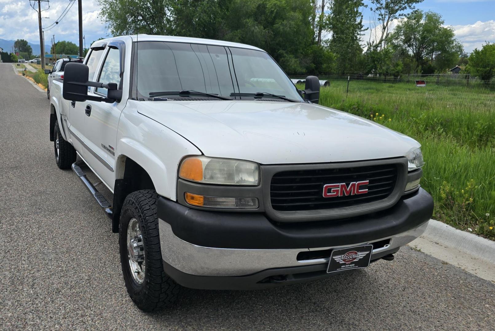 2002 White /Black GMC Sierra 2500HD SL Crew Cab Long Bed 4WD (1GTHK23192F) with an 6.6L V8 OHV 32V TURBO DIESEL engine, Automatic transmission, located at 450 N Russell, Missoula, MT, 59801, (406) 543-6600, 46.874496, -114.017433 - Discount Special. PLEASE READ! Strong running 6.6L Duramax Diesel V8 Engine. Automatic Transmission. Long Bed. 4WD. Transmission works fine as does the Four Wheel Drive. Has good Tires. AM FM Stereo. Power Windows and Locks. Does need some work, but the price reflects that. Has a power steering lea - Photo#2