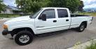 2002 White /Black GMC Sierra 2500HD SL Crew Cab Long Bed 4WD (1GTHK23192F) with an 6.6L V8 OHV 32V TURBO DIESEL engine, Automatic transmission, located at 450 N Russell, Missoula, MT, 59801, (406) 543-6600, 46.874496, -114.017433 - Discount Special. PLEASE READ! Strong running 6.6L Duramax Diesel V8 Engine. Automatic Transmission. Long Bed. 4WD. Transmission works fine as does the Four Wheel Drive. Has good Tires. AM FM Stereo. Power Windows and Locks. Does need some work, but the price reflects that. Has a power steering lea - Photo#4