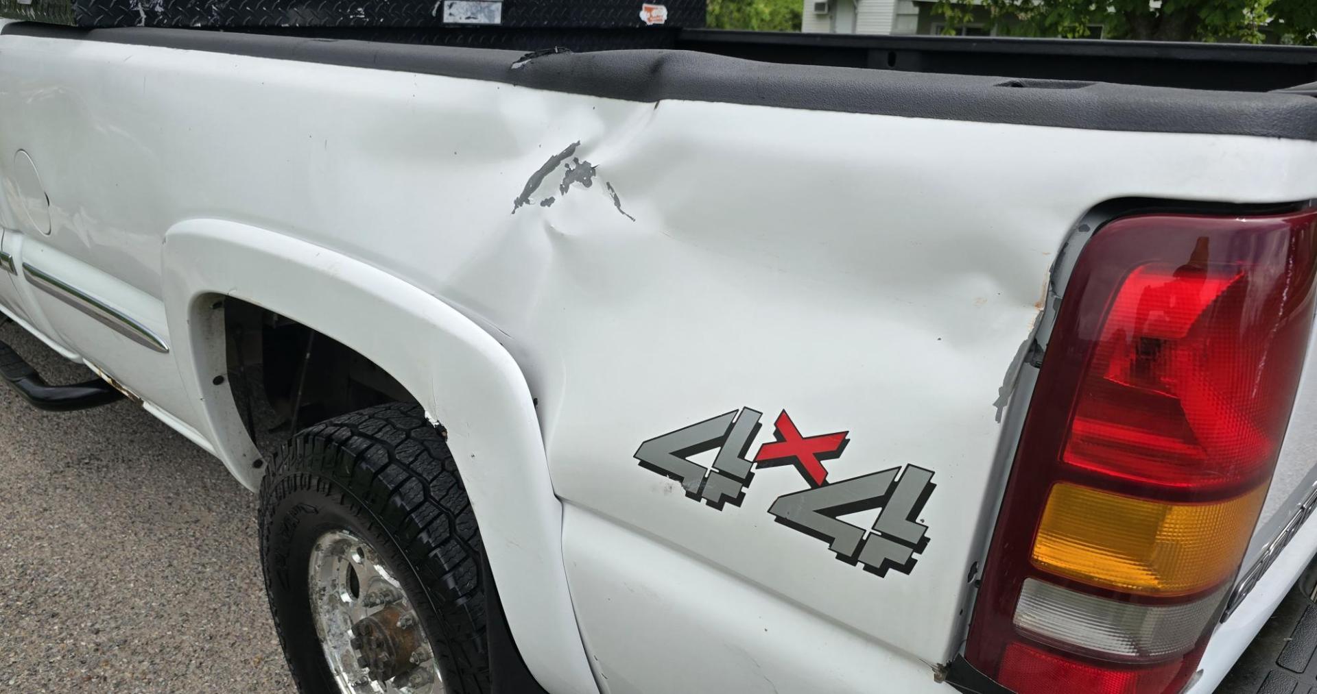 2002 White /Black GMC Sierra 2500HD SL Crew Cab Long Bed 4WD (1GTHK23192F) with an 6.6L V8 OHV 32V TURBO DIESEL engine, Automatic transmission, located at 450 N Russell, Missoula, MT, 59801, (406) 543-6600, 46.874496, -114.017433 - Discount Special. PLEASE READ! Strong running 6.6L Duramax Diesel V8 Engine. Automatic Transmission. Long Bed. 4WD. Transmission works fine as does the Four Wheel Drive. Has good Tires. AM FM Stereo. Power Windows and Locks. Does need some work, but the price reflects that. Has a power steering lea - Photo#6