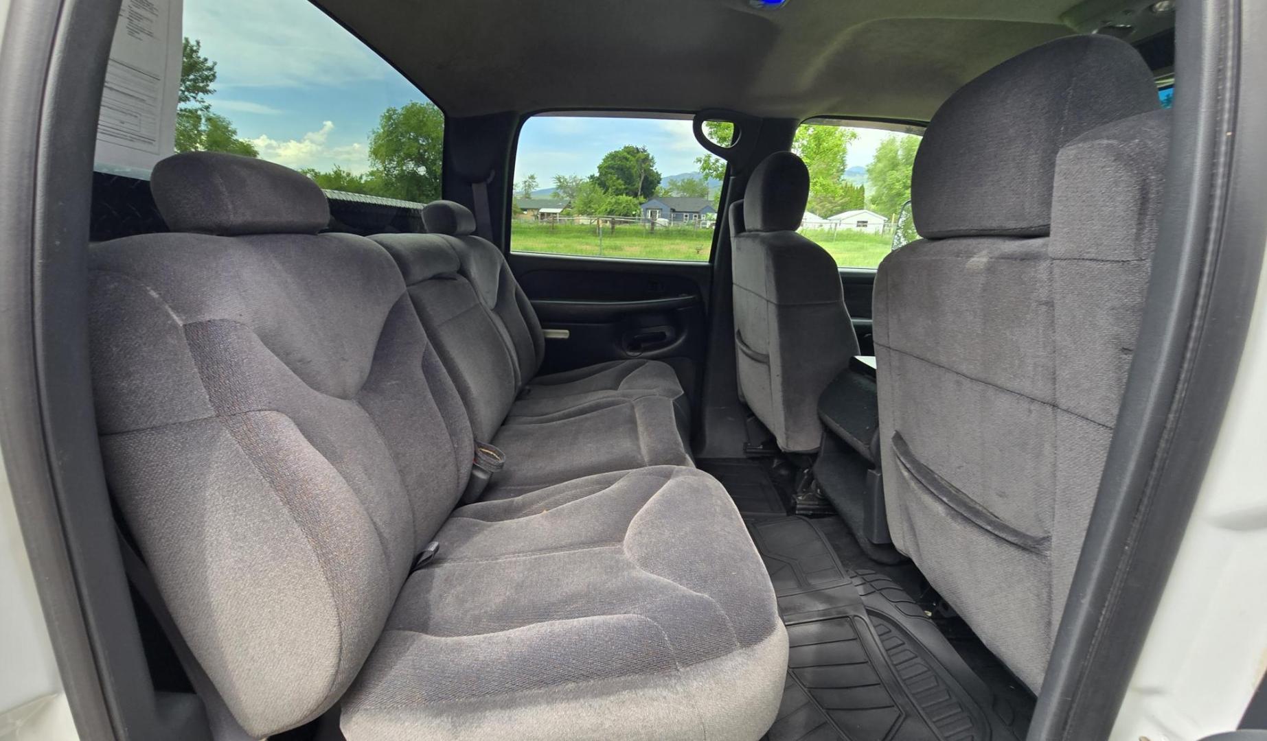 2002 White /Black GMC Sierra 2500HD SL Crew Cab Long Bed 4WD (1GTHK23192F) with an 6.6L V8 OHV 32V TURBO DIESEL engine, Automatic transmission, located at 450 N Russell, Missoula, MT, 59801, (406) 543-6600, 46.874496, -114.017433 - Discount Special. PLEASE READ! Strong running 6.6L Duramax Diesel V8 Engine. Automatic Transmission. Long Bed. 4WD. Transmission works fine as does the Four Wheel Drive. Has good Tires. AM FM Stereo. Power Windows and Locks. Does need some work, but the price reflects that. Has a power steering lea - Photo#7
