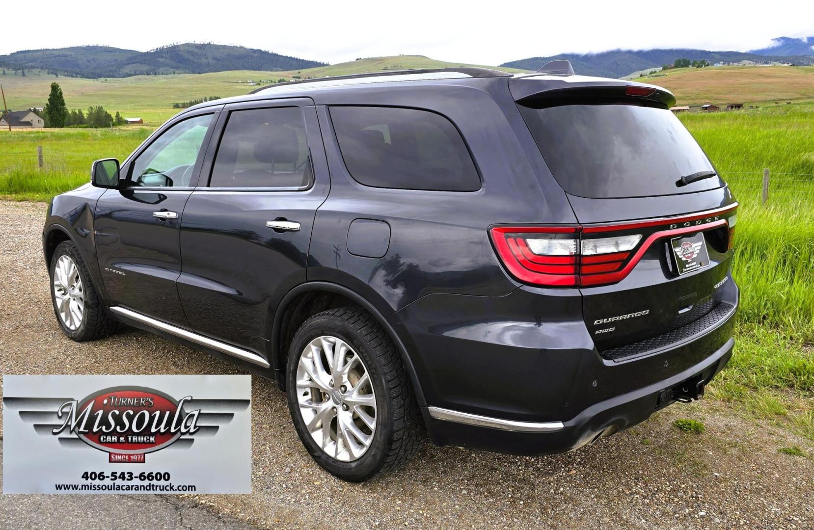 2014 Blue /Black Dodge Durango Citadel AWD (1C4SDJET1EC) with an 5.7L V8 OHV 16V engine, 8-Speed Automatic transmission, located at 450 N Russell, Missoula, MT, 59801, (406) 543-6600, 46.874496, -114.017433 - Loaded AWD Durango SUV. Powerful 5.7 Hemi V8 Engine. 8 Speed Automatic Transmission. Third Row Seating. Sunroof. Front and Middle Heated Seats. Cooled Front Seats. Heated Steering Wheel. Backup Camera. AM FM SAT CD Player. Bluetooth Audio and Phone Connection. Newly Serviced Air Conditioning. Cruise - Photo#3