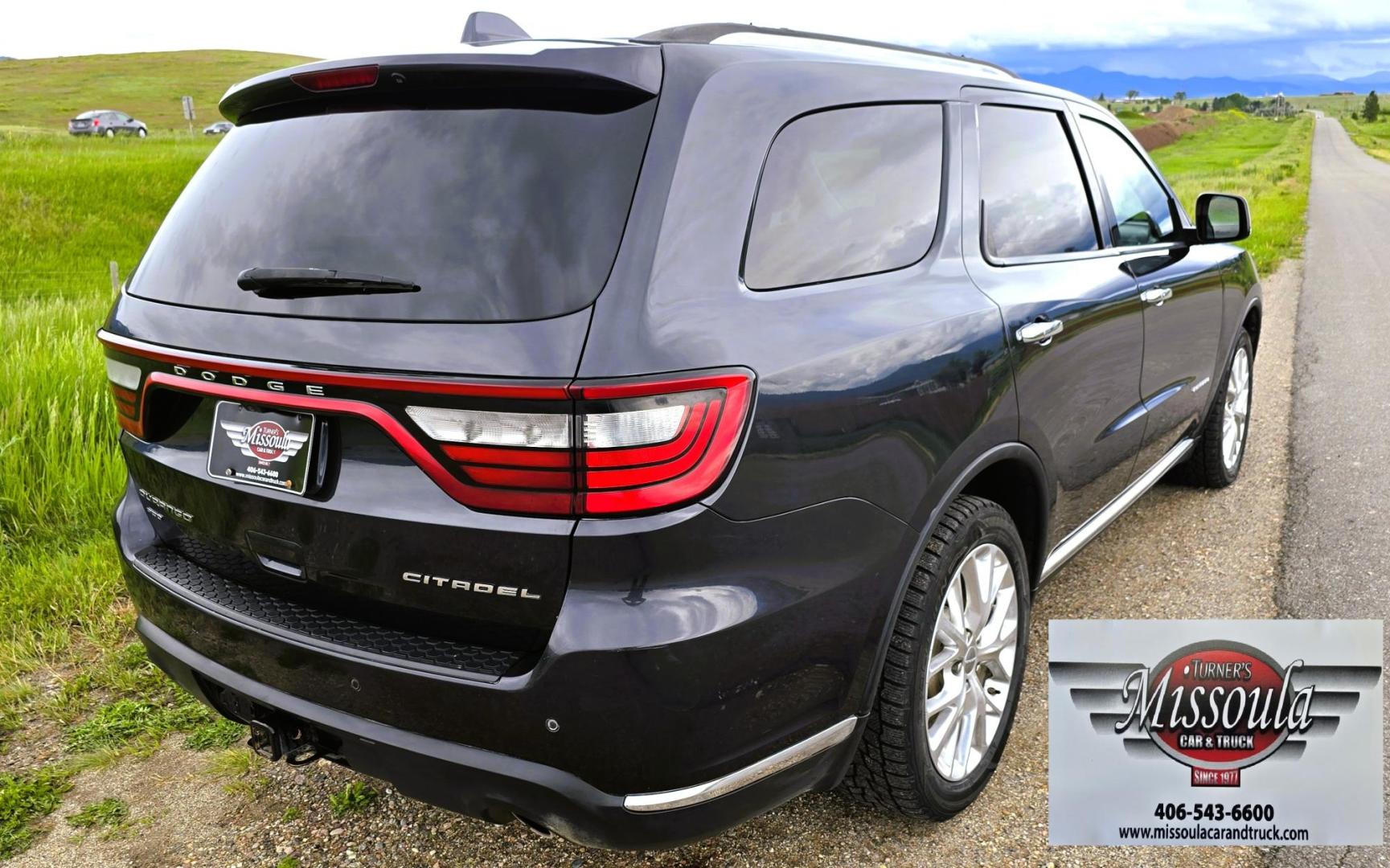 2014 Blue /Black Dodge Durango Citadel AWD (1C4SDJET1EC) with an 5.7L V8 OHV 16V engine, 8-Speed Automatic transmission, located at 450 N Russell, Missoula, MT, 59801, (406) 543-6600, 46.874496, -114.017433 - Loaded AWD Durango SUV. Powerful 5.7 Hemi V8 Engine. 8 Speed Automatic Transmission. Third Row Seating. Sunroof. Front and Middle Heated Seats. Cooled Front Seats. Heated Steering Wheel. Backup Camera. AM FM SAT CD Player. Bluetooth Audio and Phone Connection. Newly Serviced Air Conditioning. Cruise - Photo#9