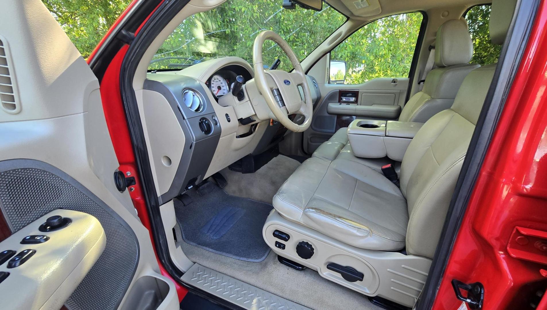 2006 Red /Tan Ford F-150 Lariat SuperCrew (1FTPW14536F) with an 5.4L V6 SOHC 16V engine, 4-Speed Automatic Overdrive transmission, located at 450 N Russell, Missoula, MT, 59801, (406) 543-6600, 46.874496, -114.017433 - Yes it's a lot of miles but it runs great! Reliable 5.4L V8 Engine. Automatic Transmission. 4WD. Power Heated Front Seats. AM FM CD Player. Power Windows and Locks. Air. Cruise. Tilt. Rear Entertainment. Running Boards. The hood and right front fender have some severe scratches from what appears to - Photo#12
