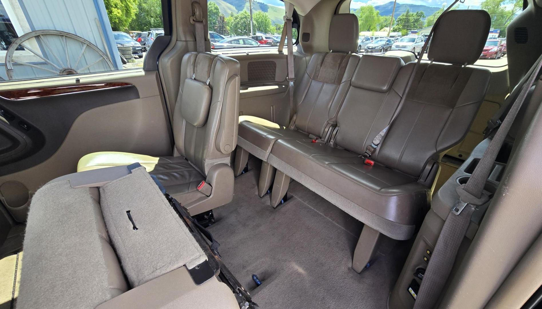 2013 Blue /Tan Chrysler Town & Country Limited (2C4RC1GG7DR) with an 3.6L V6 DOHC 24V engine, 6-Speed Automatic transmission, located at 450 N Russell, Missoula, MT, 59801, (406) 543-6600, 46.874496, -114.017433 - 2013 Town and Country FWD Mini-Van. These are getting hard to come by. This particular one has many features. 3.6L V6 Engine. 3rd Row Seating. Heated Front and Middle Seats. Heated Steering Wheel. DVD Entertainment System for the 2nd and 3rd Rows. Navigation. Bluetooth. AM FM SAT CD Player. Power Sl- Photo#9