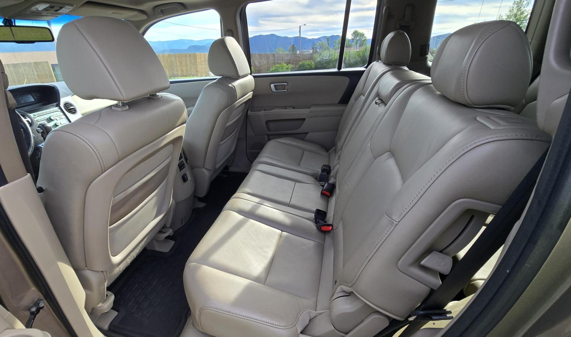 2011 Gold /Tan Honda Pilot EX-L 4WD 5-Spd AT (5FNYF4H57BB) with an 3.5L V6 SOHC 24V engine, 5-Speed Automatic transmission, located at 450 N Russell, Missoula, MT, 59801, (406) 543-6600, 46.874496, -114.017433 - Another great running Honda AWD. Reliable 3.5L V6 Engine. Heated Front Seats, 3rd Row Seats. Sunroof. Front and Rear Climate Control. Air. Cruise. Tilt. Power Windows and Locks. AM FM CD Changer. Tow Hitch. Clean Title and Carfax. Come by for a test drive. You won't be disappointed. - Photo#9