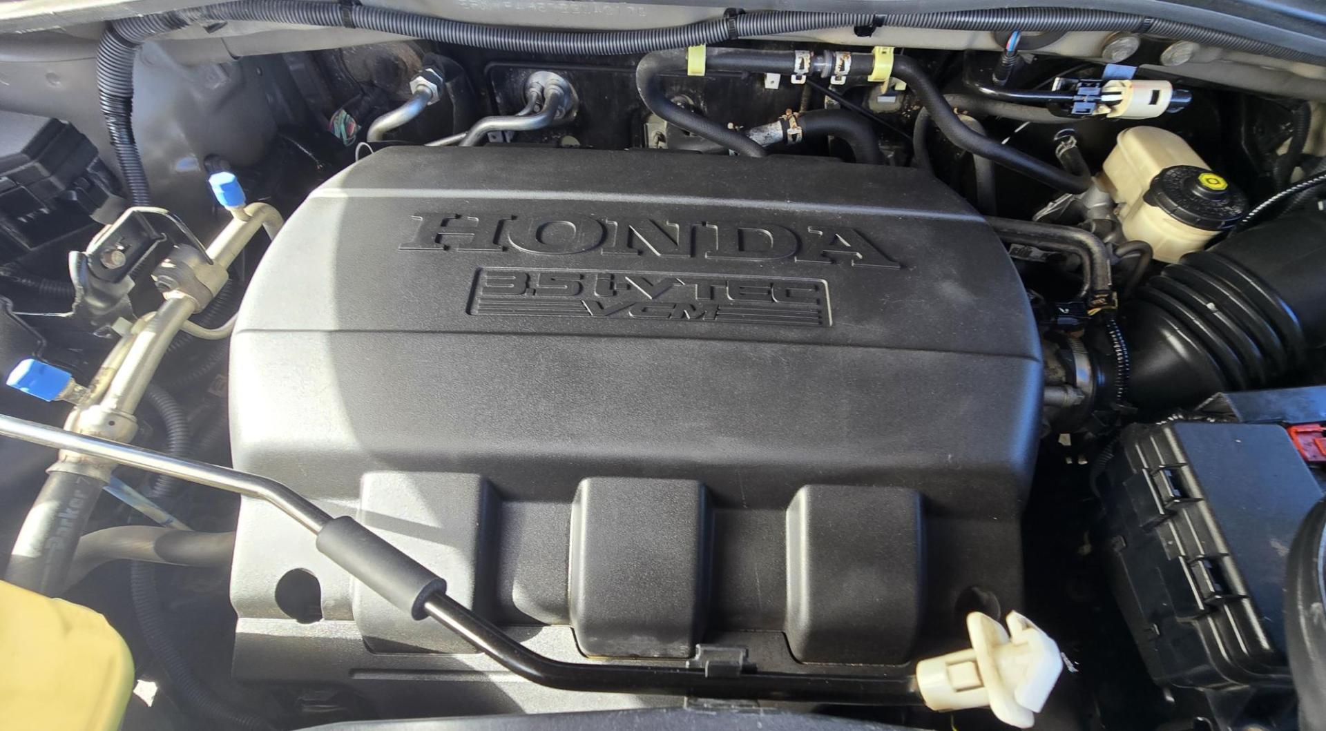 2011 Gold /Tan Honda Pilot EX-L 4WD 5-Spd AT (5FNYF4H57BB) with an 3.5L V6 SOHC 24V engine, 5-Speed Automatic transmission, located at 450 N Russell, Missoula, MT, 59801, (406) 543-6600, 46.874496, -114.017433 - Another great running Honda AWD. Reliable 3.5L V6 Engine. Heated Front Seats, 3rd Row Seats. Sunroof. Front and Rear Climate Control. Air. Cruise. Tilt. Power Windows and Locks. AM FM CD Changer. Tow Hitch. Clean Title and Carfax. Come by for a test drive. You won't be disappointed. - Photo#15