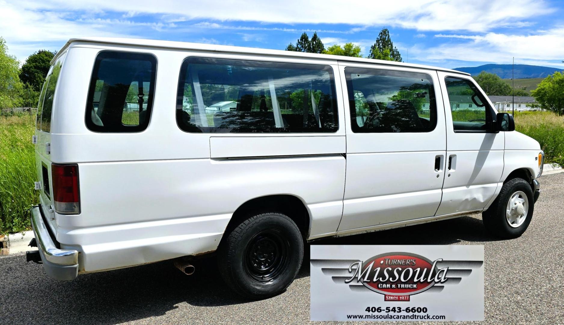 2001 White /Gray Ford Econoline E-350 Extended (1FBSS31L01H) with an 5.4L V8 SOHC 16V engine, 4-Speed Automatic Overdrive transmission, located at 450 N Russell, Missoula, MT, 59801, (406) 543-6600, 46.874496, -114.017433 - Extended Length One Ton Passenger Van that seats 14. 5.4L V8 Engine. Automatic Transmission. Rear Wheel Drive. Air Conditioning. Cruise Control. AM FM Cassette Player. Runs Great. Set up for towing. This vehicle was in a MINOR accident in 2021 and because the damage was more than the cost to repair - Photo#4
