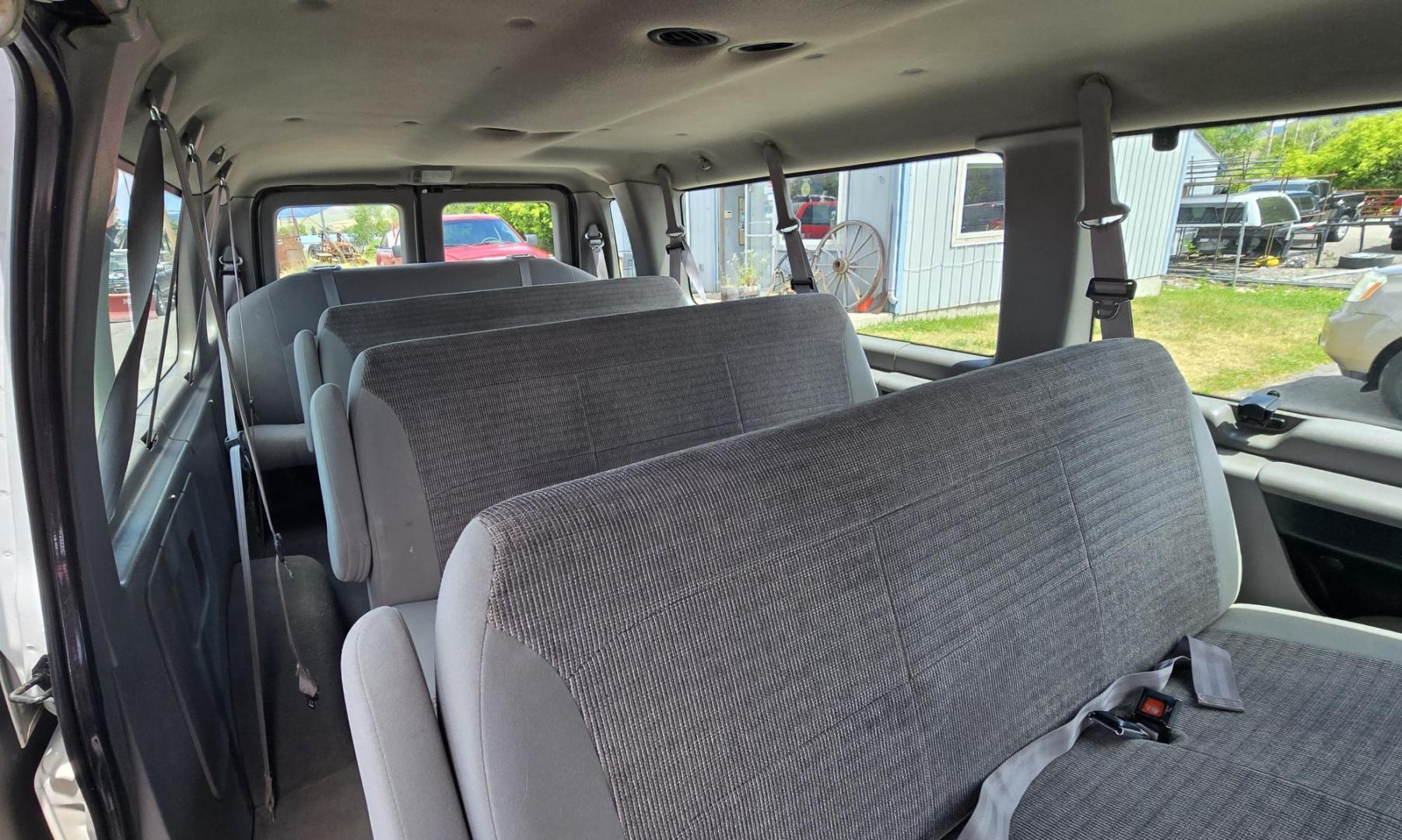 2001 White /Gray Ford Econoline E-350 Extended (1FBSS31L01H) with an 5.4L V8 SOHC 16V engine, 4-Speed Automatic Overdrive transmission, located at 450 N Russell, Missoula, MT, 59801, (406) 543-6600, 46.874496, -114.017433 - Extended Length One Ton Passenger Van that seats 14. 5.4L V8 Engine. Automatic Transmission. Rear Wheel Drive. Air Conditioning. Cruise Control. AM FM Cassette Player. Runs Great. Set up for towing. This vehicle was in a MINOR accident in 2021 and because the damage was more than the cost to repair - Photo#12