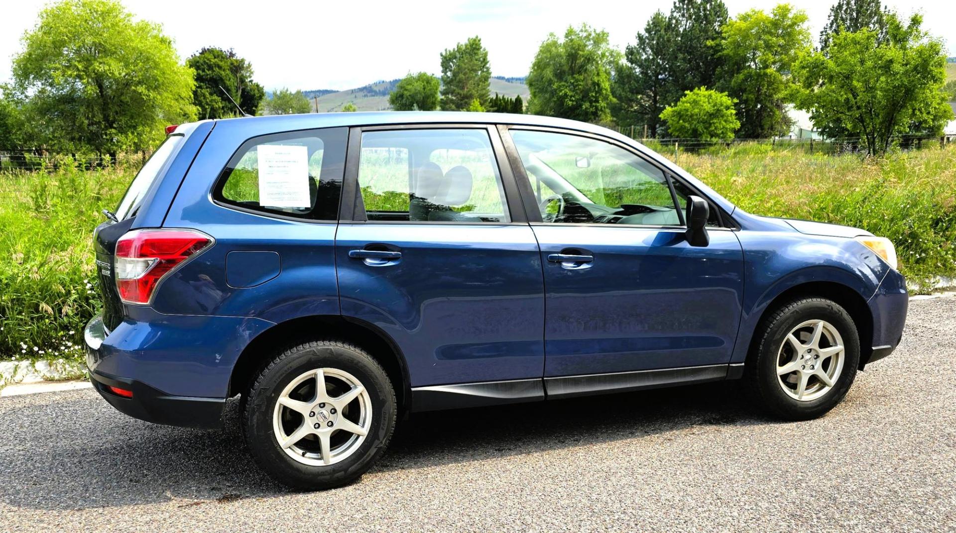 2014 Blue /White Subaru Forester 2.5i (JF2SJAAC6EH) with an 2.5L H4 SOHC 16V engine, 6-Speed Automatic transmission, located at 450 N Russell, Missoula, MT, 59801, (406) 543-6600, 46.874496, -114.017433 - Patriotic Blue 2 Owner Subaru with a clean Title and Carfax. 2.5L I4 Engine. Automatic Transmission. Air Conditioning. Cruise Control. Power Windows and Locks. AM FM CD Player. Bluetooth Audio and Phone Connection. Tires are in Very Good Condition. We Finance through local Credit Unions. We do N- Photo#4