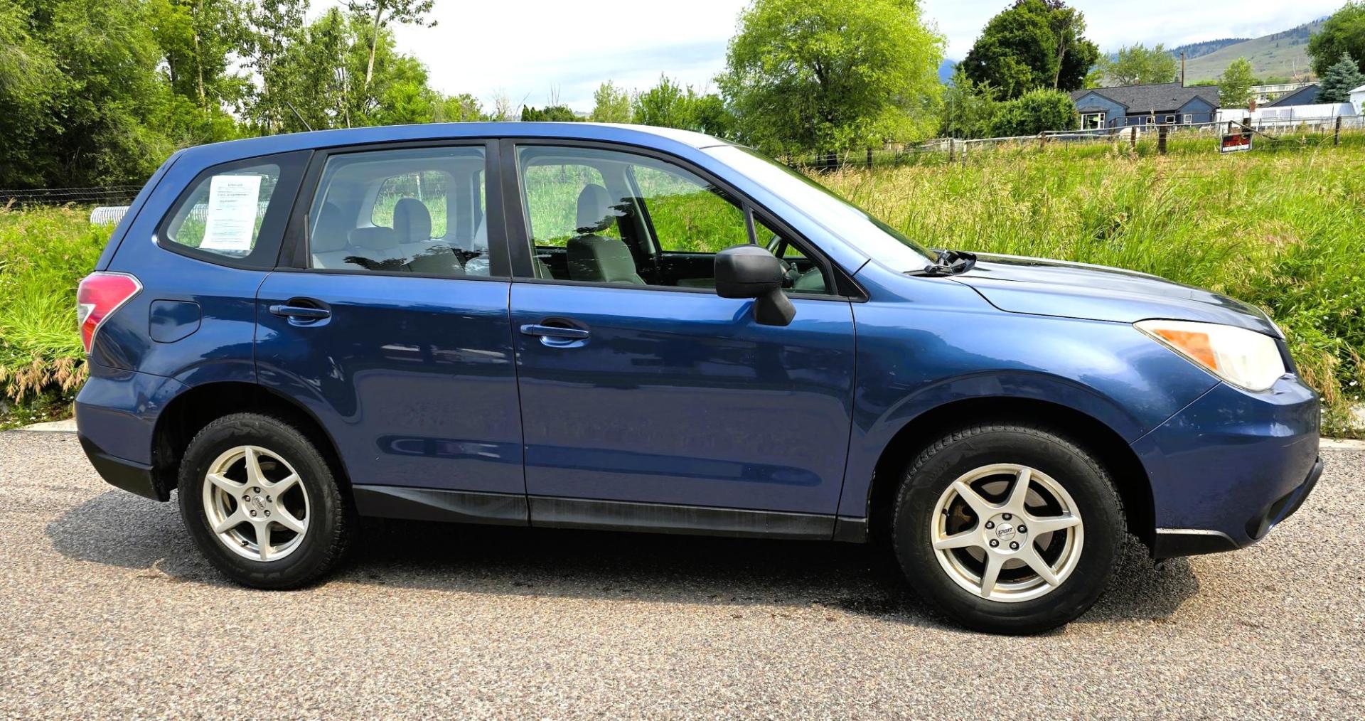 2014 Blue /White Subaru Forester 2.5i (JF2SJAAC6EH) with an 2.5L H4 SOHC 16V engine, 6-Speed Automatic transmission, located at 450 N Russell, Missoula, MT, 59801, (406) 543-6600, 46.874496, -114.017433 - Patriotic Blue 2 Owner Subaru with a clean Title and Carfax. 2.5L I4 Engine. Automatic Transmission. Air Conditioning. Cruise Control. Power Windows and Locks. AM FM CD Player. Bluetooth Audio and Phone Connection. Tires are in Very Good Condition. We Finance through local Credit Unions. We do N- Photo#5