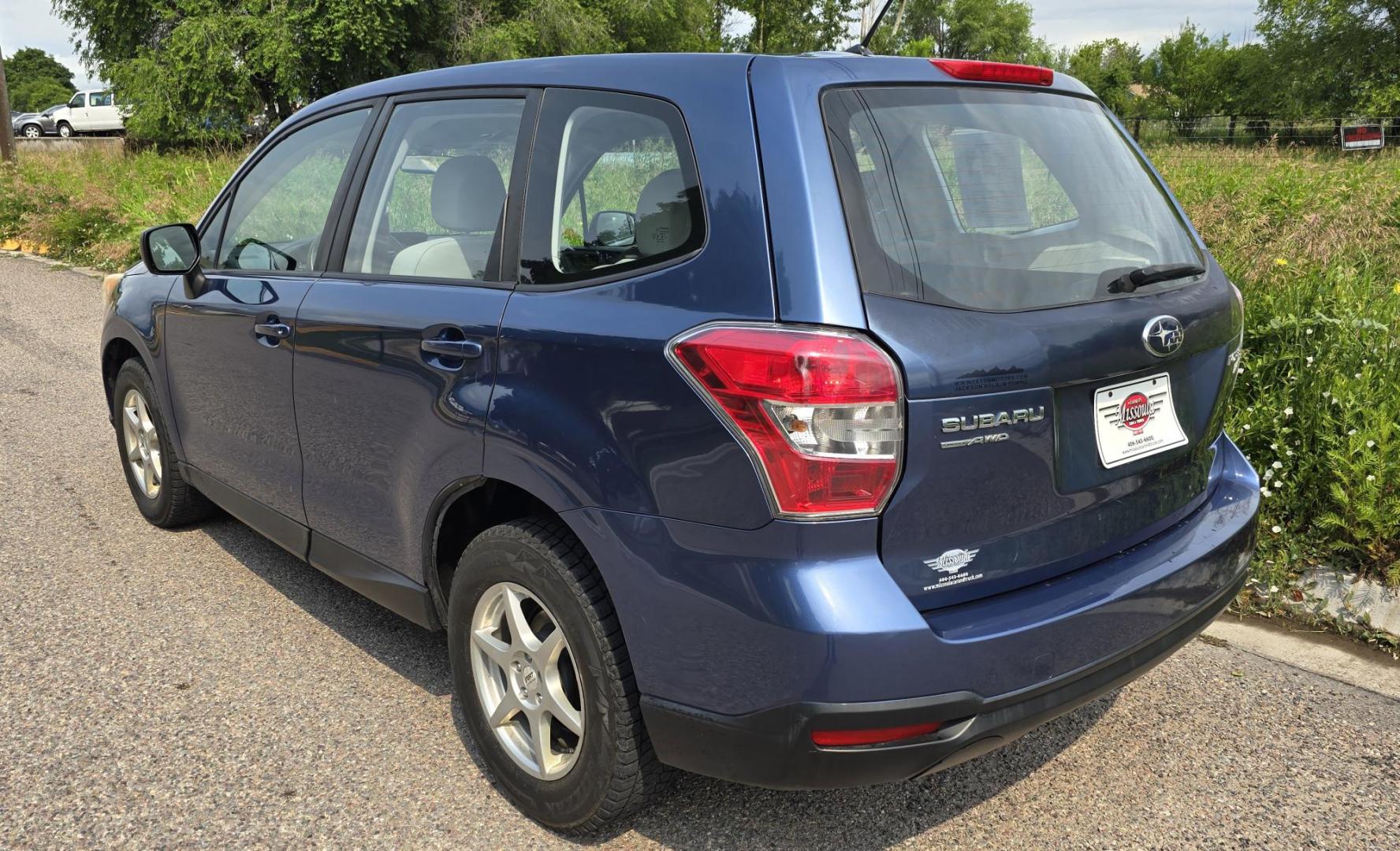 2014 Blue /White Subaru Forester 2.5i (JF2SJAAC6EH) with an 2.5L H4 SOHC 16V engine, 6-Speed Automatic transmission, located at 450 N Russell, Missoula, MT, 59801, (406) 543-6600, 46.874496, -114.017433 - Patriotic Blue 2 Owner Subaru with a clean Title and Carfax. 2.5L I4 Engine. Automatic Transmission. Air Conditioning. Cruise Control. Power Windows and Locks. AM FM CD Player. Bluetooth Audio and Phone Connection. Tires are in Very Good Condition. We Finance through local Credit Unions. We do N- Photo#12