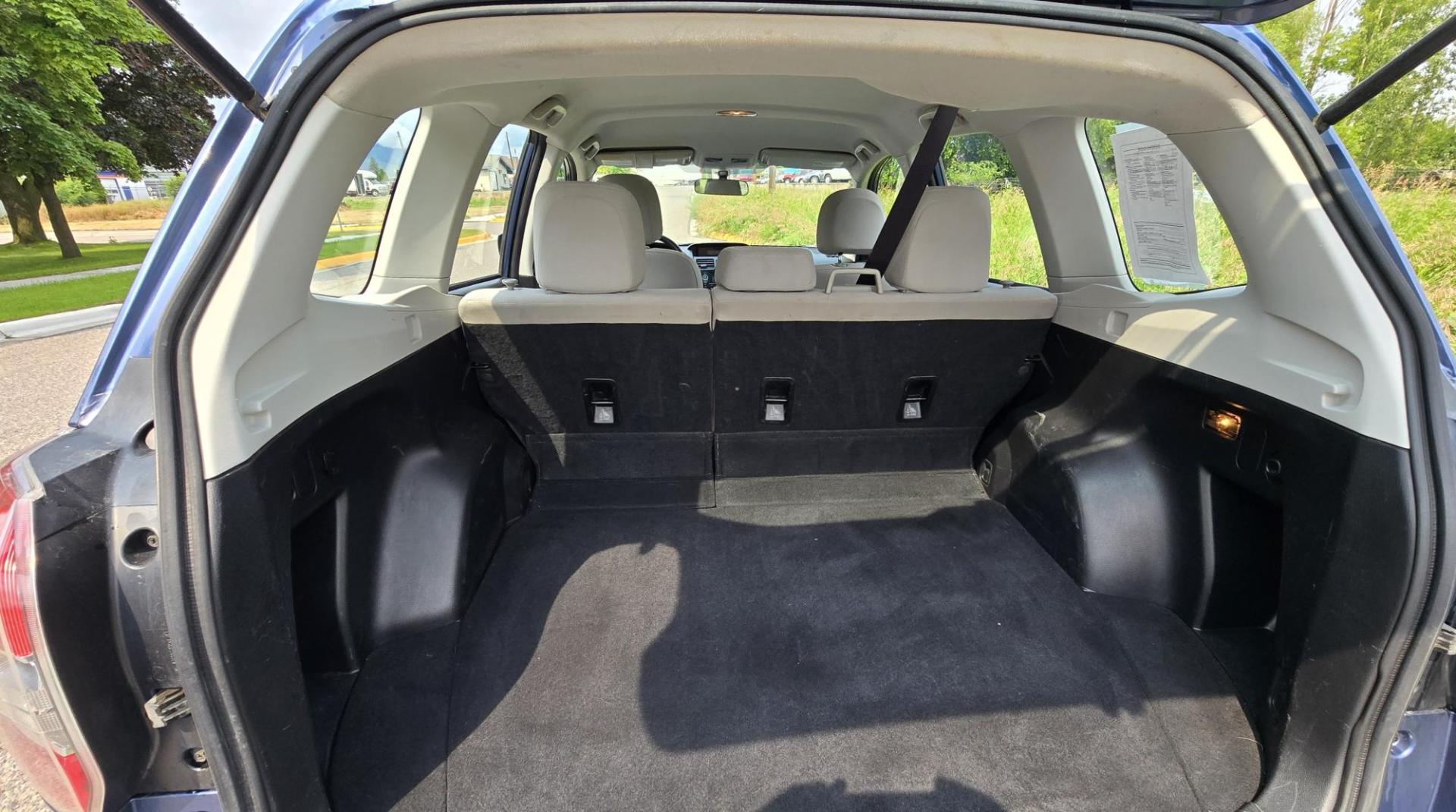 2014 Blue /White Subaru Forester 2.5i (JF2SJAAC6EH) with an 2.5L H4 SOHC 16V engine, 6-Speed Automatic transmission, located at 450 N Russell, Missoula, MT, 59801, (406) 543-6600, 46.874496, -114.017433 - Patriotic Blue 2 Owner Subaru with a clean Title and Carfax. 2.5L I4 Engine. Automatic Transmission. Air Conditioning. Cruise Control. Power Windows and Locks. AM FM CD Player. Bluetooth Audio and Phone Connection. Tires are in Very Good Condition. We Finance through local Credit Unions. We do N- Photo#13