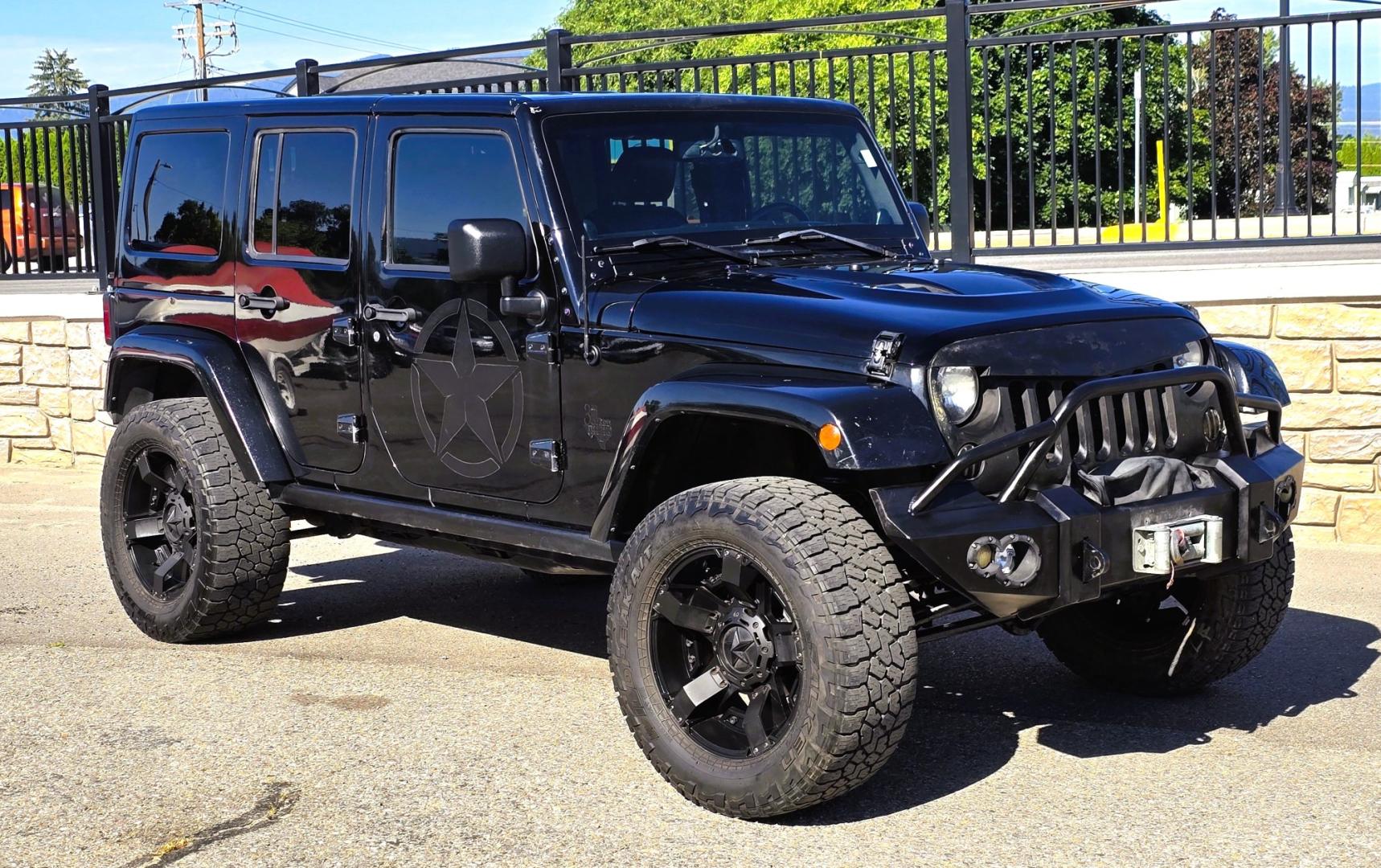 2013 Black /Black Jeep Wrangler Unlimited Rubicon 4WD (1C4HJWFG2DL) with an 3.6L V6 DOHC 24V FFV engine, Automatic transmission, located at 450 N Russell, Missoula, MT, 59801, (406) 543-6600, 46.874496, -114.017433 - Ready for Off-Road or a Classy Date on the town. 2013 Jeep Rubicon 4WD. 4 Door with a Hardtop. 3.6L V6 Engine. Automatic Transmission. Heated Front Seats. Nice Aftermarket Wheels. 8K Lb Winch in on Heavy Duty Front Bumper. Air Conditioning. Touch Screen Stereo with Bluetooth Phone. Power Windows and- Photo#4