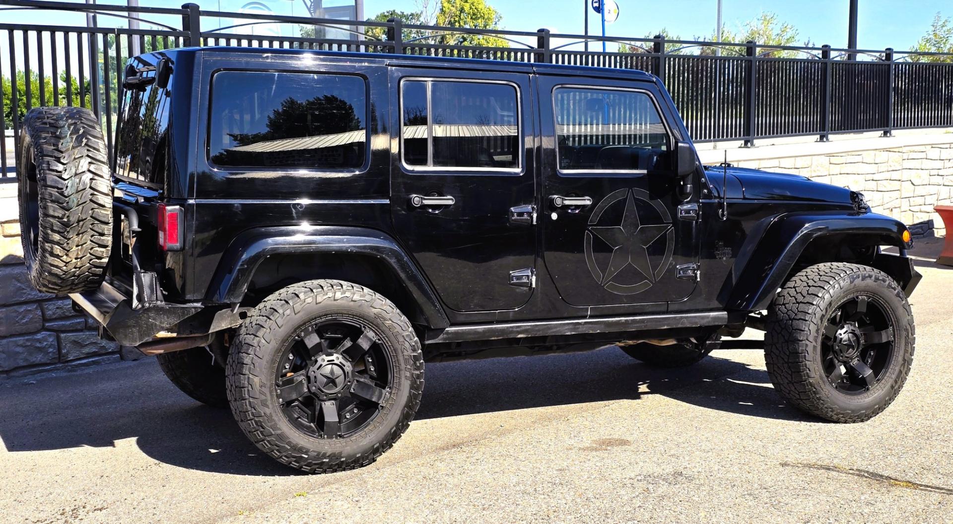 2013 Black /Black Jeep Wrangler Unlimited Rubicon 4WD (1C4HJWFG2DL) with an 3.6L V6 DOHC 24V FFV engine, Automatic transmission, located at 450 N Russell, Missoula, MT, 59801, (406) 543-6600, 46.874496, -114.017433 - Ready for Off-Road or a Classy Date on the town. 2013 Jeep Rubicon 4WD. 4 Door with a Hardtop. 3.6L V6 Engine. Automatic Transmission. Heated Front Seats. Nice Aftermarket Wheels. 8K Lb Winch in on Heavy Duty Front Bumper. Air Conditioning. Touch Screen Stereo with Bluetooth Phone. Power Windows and- Photo#3
