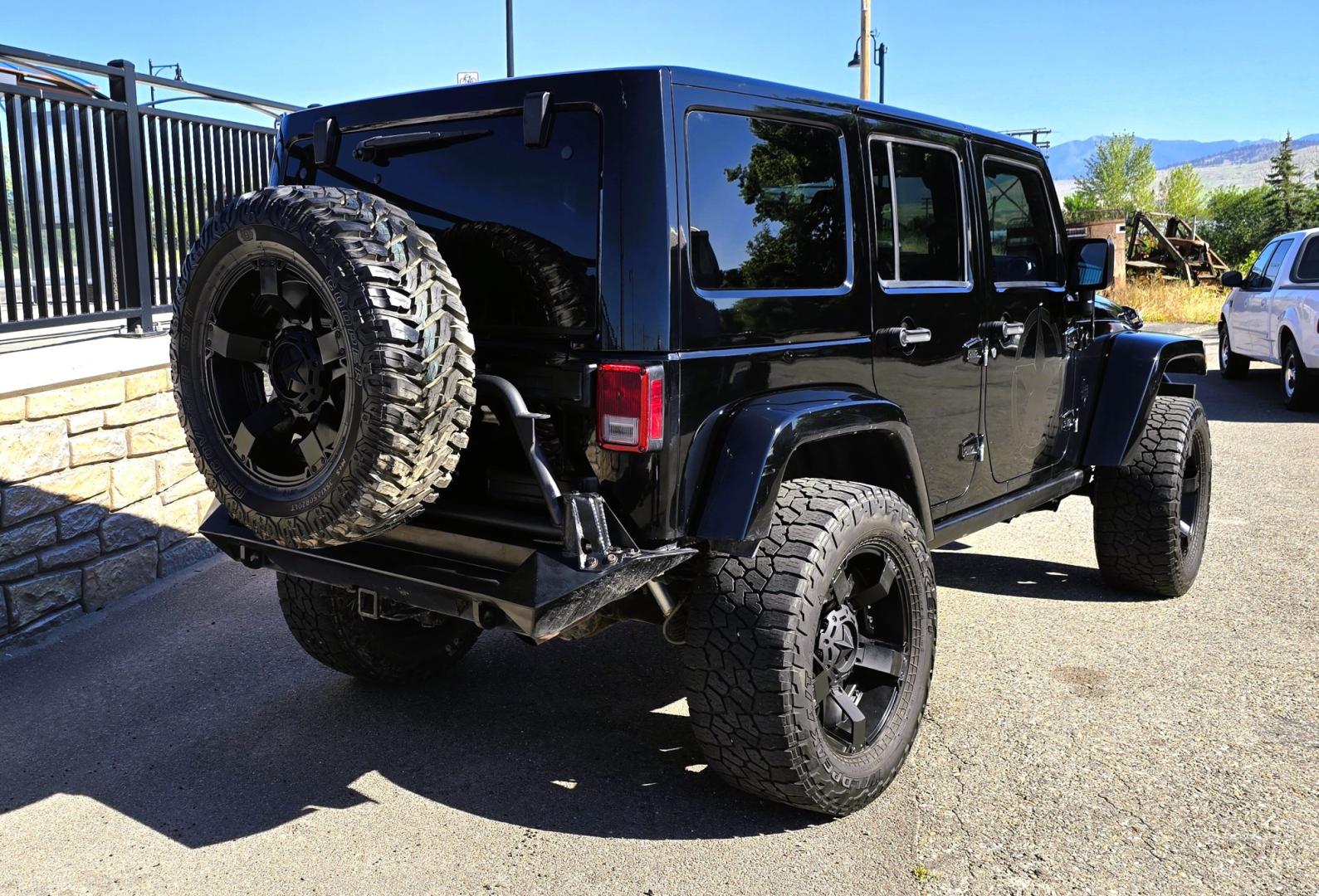 2013 Black /Black Jeep Wrangler Unlimited Rubicon 4WD (1C4HJWFG2DL) with an 3.6L V6 DOHC 24V FFV engine, Automatic transmission, located at 450 N Russell, Missoula, MT, 59801, (406) 543-6600, 46.874496, -114.017433 - Ready for Off-Road or a Classy Date on the town. 2013 Jeep Rubicon 4WD. 4 Door with a Hardtop. 3.6L V6 Engine. Automatic Transmission. Heated Front Seats. Nice Aftermarket Wheels. 8K Lb Winch in on Heavy Duty Front Bumper. Air Conditioning. Touch Screen Stereo with Bluetooth Phone. Power Windows and- Photo#6