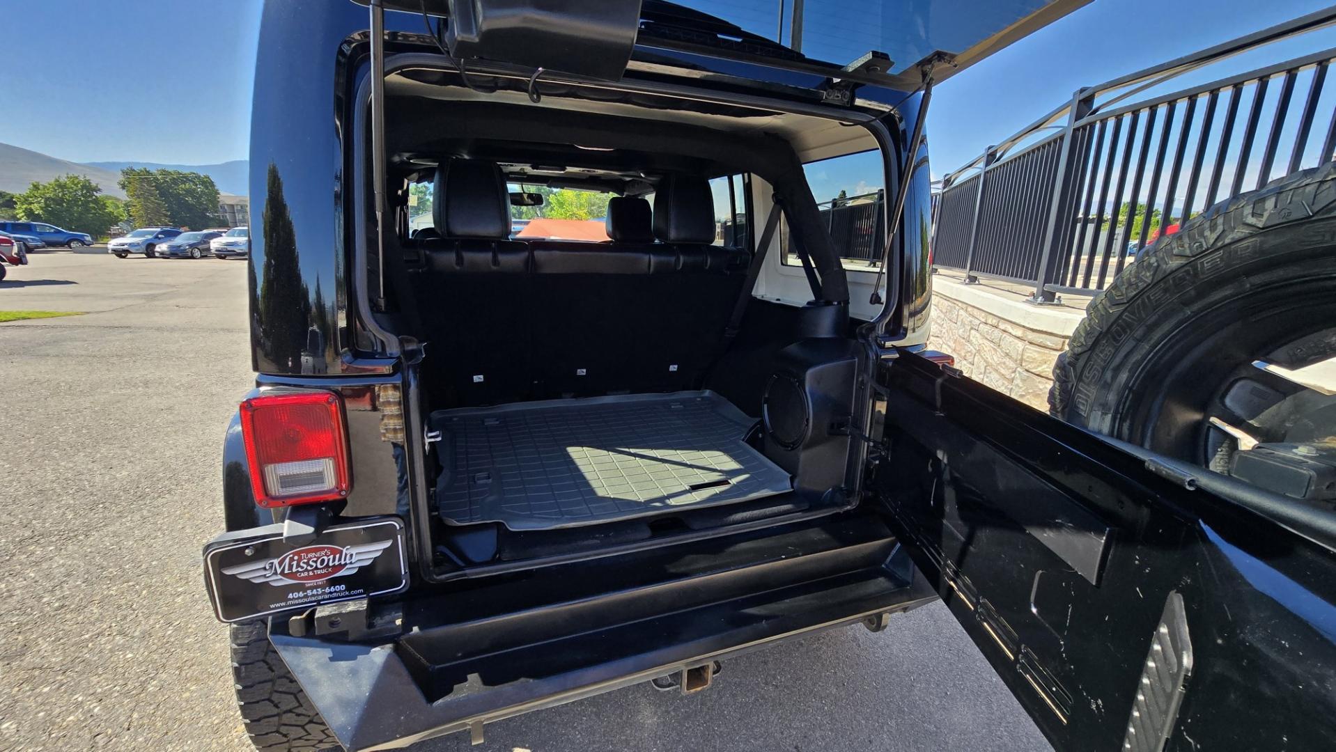 2013 Black /Black Jeep Wrangler Unlimited Rubicon 4WD (1C4HJWFG2DL) with an 3.6L V6 DOHC 24V FFV engine, Automatic transmission, located at 450 N Russell, Missoula, MT, 59801, (406) 543-6600, 46.874496, -114.017433 - Ready for Off-Road or a Classy Date on the town. 2013 Jeep Rubicon 4WD. 4 Door with a Hardtop. 3.6L V6 Engine. Automatic Transmission. Heated Front Seats. Nice Aftermarket Wheels. 8K Lb Winch in on Heavy Duty Front Bumper. Air Conditioning. Touch Screen Stereo with Bluetooth Phone. Power Windows and- Photo#11