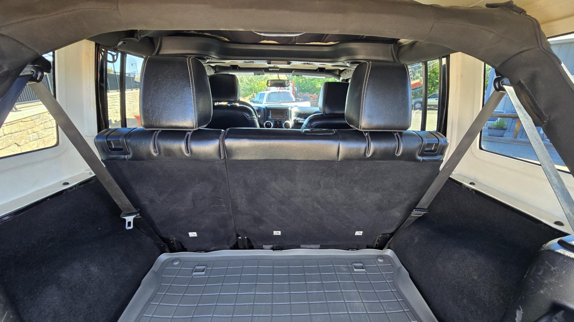 2013 Black /Black Jeep Wrangler Unlimited Rubicon 4WD (1C4HJWFG2DL) with an 3.6L V6 DOHC 24V FFV engine, Automatic transmission, located at 450 N Russell, Missoula, MT, 59801, (406) 543-6600, 46.874496, -114.017433 - Ready for Off-Road or a Classy Date on the town. 2013 Jeep Rubicon 4WD. 4 Door with a Hardtop. 3.6L V6 Engine. Automatic Transmission. Heated Front Seats. Nice Aftermarket Wheels. 8K Lb Winch in on Heavy Duty Front Bumper. Air Conditioning. Touch Screen Stereo with Bluetooth Phone. Power Windows and- Photo#14