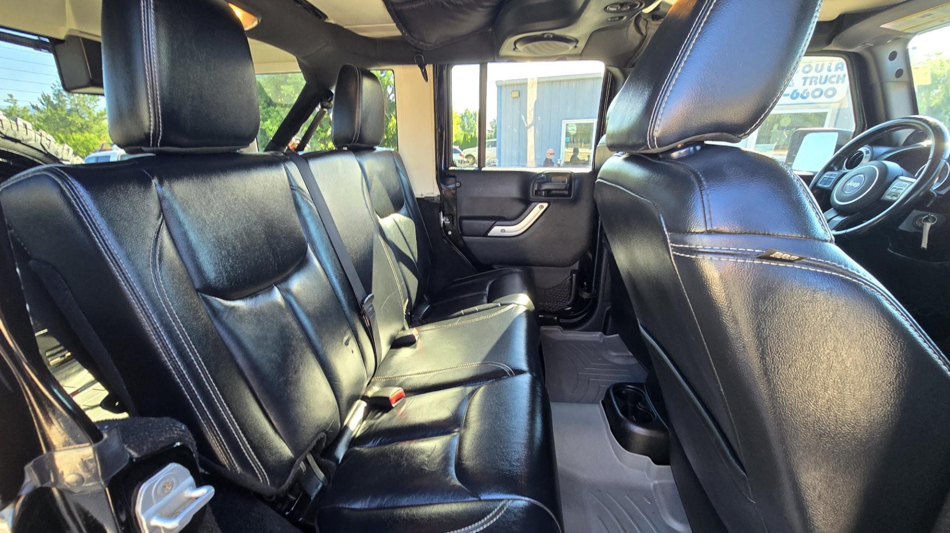 2013 Black /Black Jeep Wrangler Unlimited Rubicon 4WD (1C4HJWFG2DL) with an 3.6L V6 DOHC 24V FFV engine, Automatic transmission, located at 450 N Russell, Missoula, MT, 59801, (406) 543-6600, 46.874496, -114.017433 - Ready for Off-Road or a Classy Date on the town. 2013 Jeep Rubicon 4WD. 4 Door with a Hardtop. 3.6L V6 Engine. Automatic Transmission. Heated Front Seats. Nice Aftermarket Wheels. 8K Lb Winch in on Heavy Duty Front Bumper. Air Conditioning. Touch Screen Stereo with Bluetooth Phone. Power Windows and- Photo#19