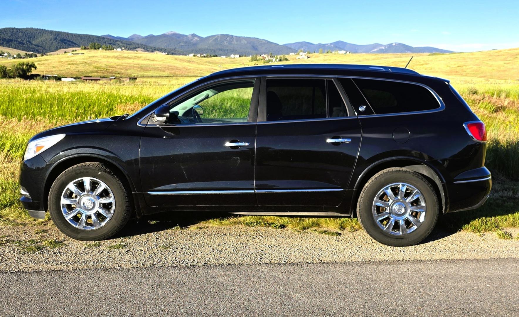 2014 Grey /Gray Buick Enclave Premium AWD (5GAKVCKD4EJ) with an 3.6L V6 DOHC 24V engine, 6-Speed Automatic Overdrive transmission, located at 450 N Russell, Missoula, MT, 59801, (406) 543-6600, 46.874496, -114.017433 - Gorgeous Dark Metallic Gray AWD Buick Enclave. Might be the nicest car on our lot. Reliable 3.6L V6 Engine. 6 Speed Automatic Overdrive Transmission. Panoramic Sunroof. Navigation. 3rd Row Seats. Middle Bucket Seats. Front Seats are Heated and Cooled. Navigation. AM FM XM CD Player, Bluetooth Audio- Photo#1