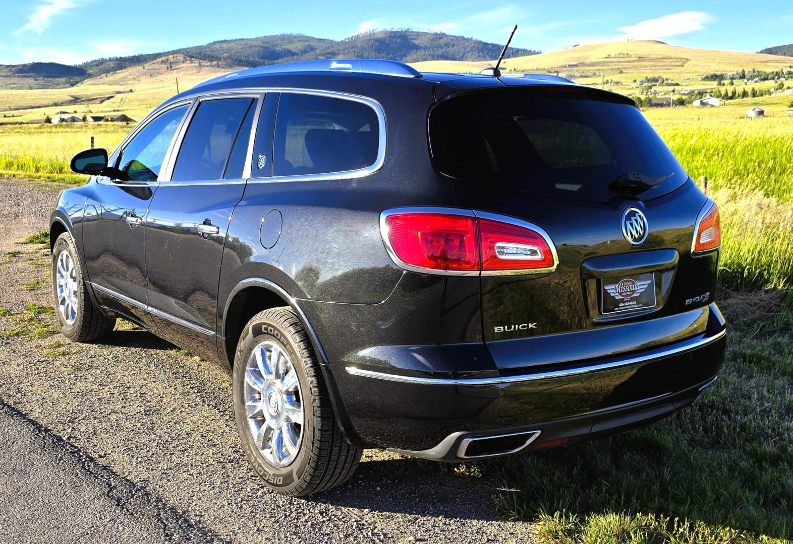 2014 Grey /Gray Buick Enclave Premium AWD (5GAKVCKD4EJ) with an 3.6L V6 DOHC 24V engine, 6-Speed Automatic Overdrive transmission, located at 450 N Russell, Missoula, MT, 59801, (406) 543-6600, 46.874496, -114.017433 - Gorgeous Dark Metallic Gray AWD Buick Enclave. Might be the nicest car on our lot. Reliable 3.6L V6 Engine. 6 Speed Automatic Overdrive Transmission. Panoramic Sunroof. Navigation. 3rd Row Seats. Middle Bucket Seats. Front Seats are Heated and Cooled. Navigation. AM FM XM CD Player, Bluetooth Audio- Photo#4