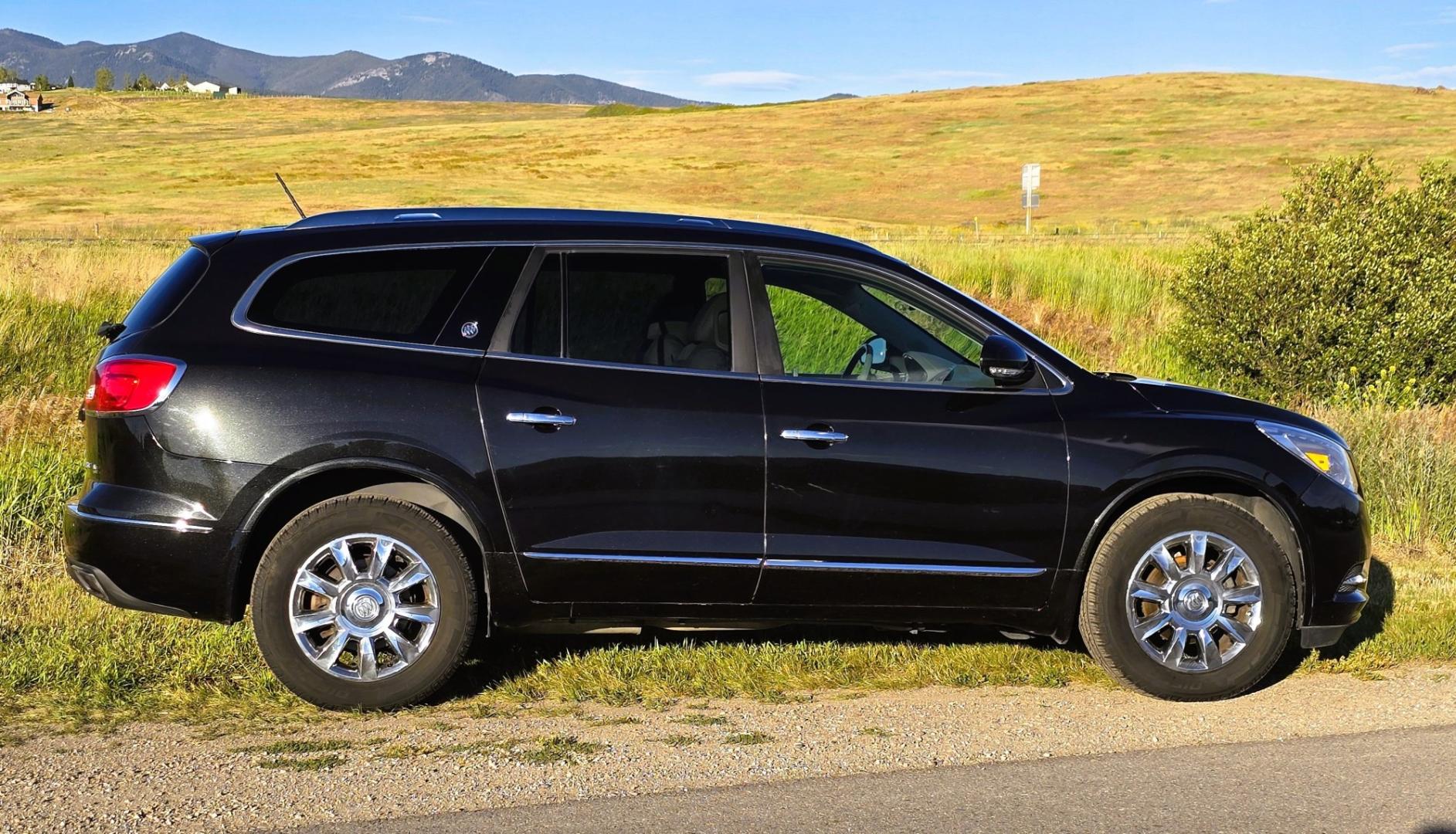 2014 Grey /Gray Buick Enclave Premium AWD (5GAKVCKD4EJ) with an 3.6L V6 DOHC 24V engine, 6-Speed Automatic Overdrive transmission, located at 450 N Russell, Missoula, MT, 59801, (406) 543-6600, 46.874496, -114.017433 - Gorgeous Dark Metallic Gray AWD Buick Enclave. Might be the nicest car on our lot. Reliable 3.6L V6 Engine. 6 Speed Automatic Overdrive Transmission. Panoramic Sunroof. Navigation. 3rd Row Seats. Middle Bucket Seats. Front Seats are Heated and Cooled. Navigation. AM FM XM CD Player, Bluetooth Audio- Photo#5