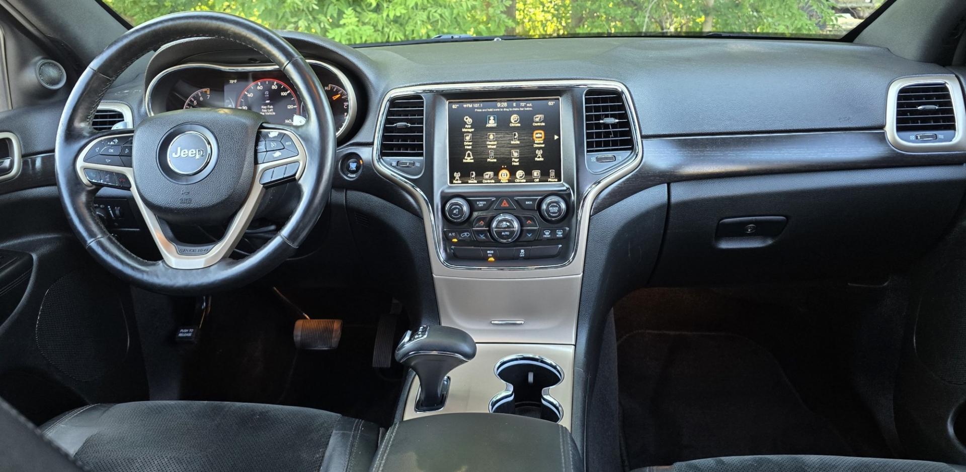 2014 Grey /Black Jeep Grand Cherokee Laredo 4WD (1C4RJFAG3EC) with an 3.6L V6 DOHC 24V engine, 5-Speed Automatic transmission, located at 450 N Russell, Missoula, MT, 59801, (406) 543-6600, 46.874496, -114.017433 - Stylish Jeep Grand Cherokee Altitude AWD. Reliable 3.6L V6 Engine. Heated Front Seats. Heated Steering Wheel. Power Sunroof. Power Windows and Locks. AM FM XM. Bluetooth Audio and Phone Connection. Toyo Tires. Power Liftgate. Very Comfortable to drive. We Finance through local Credit Unions. W- Photo#16