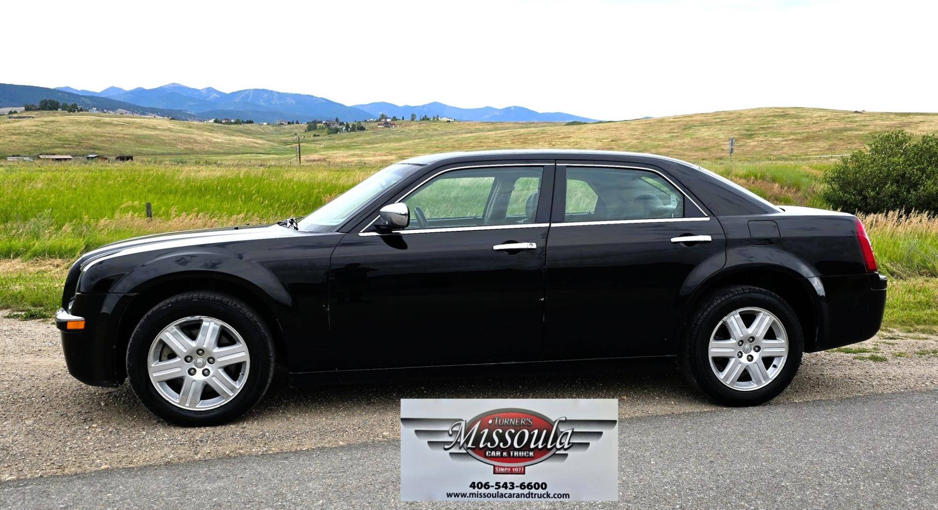 2006 Black /Black Chrysler 300 C AWD (2C3KK63H36H) with an 5.7L V8 OHV 16V engine, 5A OD transmission, located at 450 N Russell, Missoula, MT, 59801, (406) 543-6600, 46.874496, -114.017433 - Tons of Power with a 5.7L V8 Hemi Engine. Comfortable to drive. 5 Speed Automatic Overdrive Transmission. AWD. Heated Power Front Seats. Air Conditioning. CRusie Control. Power Windows and Locks. Aftermarket Touch Screen Stereo. Because oft he age of this vehicle, our lenders do NOT offer finan- Photo#0