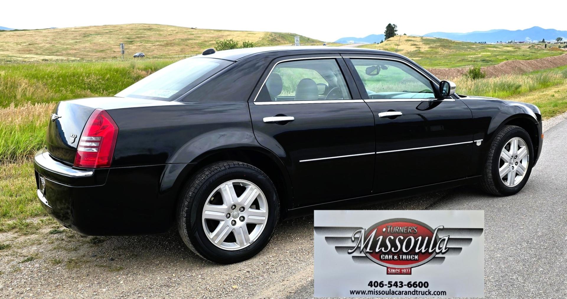2006 Black /Black Chrysler 300 C AWD (2C3KK63H36H) with an 5.7L V8 OHV 16V engine, 5A OD transmission, located at 450 N Russell, Missoula, MT, 59801, (406) 543-6600, 46.874496, -114.017433 - Tons of Power with a 5.7L V8 Hemi Engine. Comfortable to drive. 5 Speed Automatic Overdrive Transmission. AWD. Heated Power Front Seats. Air Conditioning. CRusie Control. Power Windows and Locks. Aftermarket Touch Screen Stereo. Because oft he age of this vehicle, our lenders do NOT offer finan- Photo#5