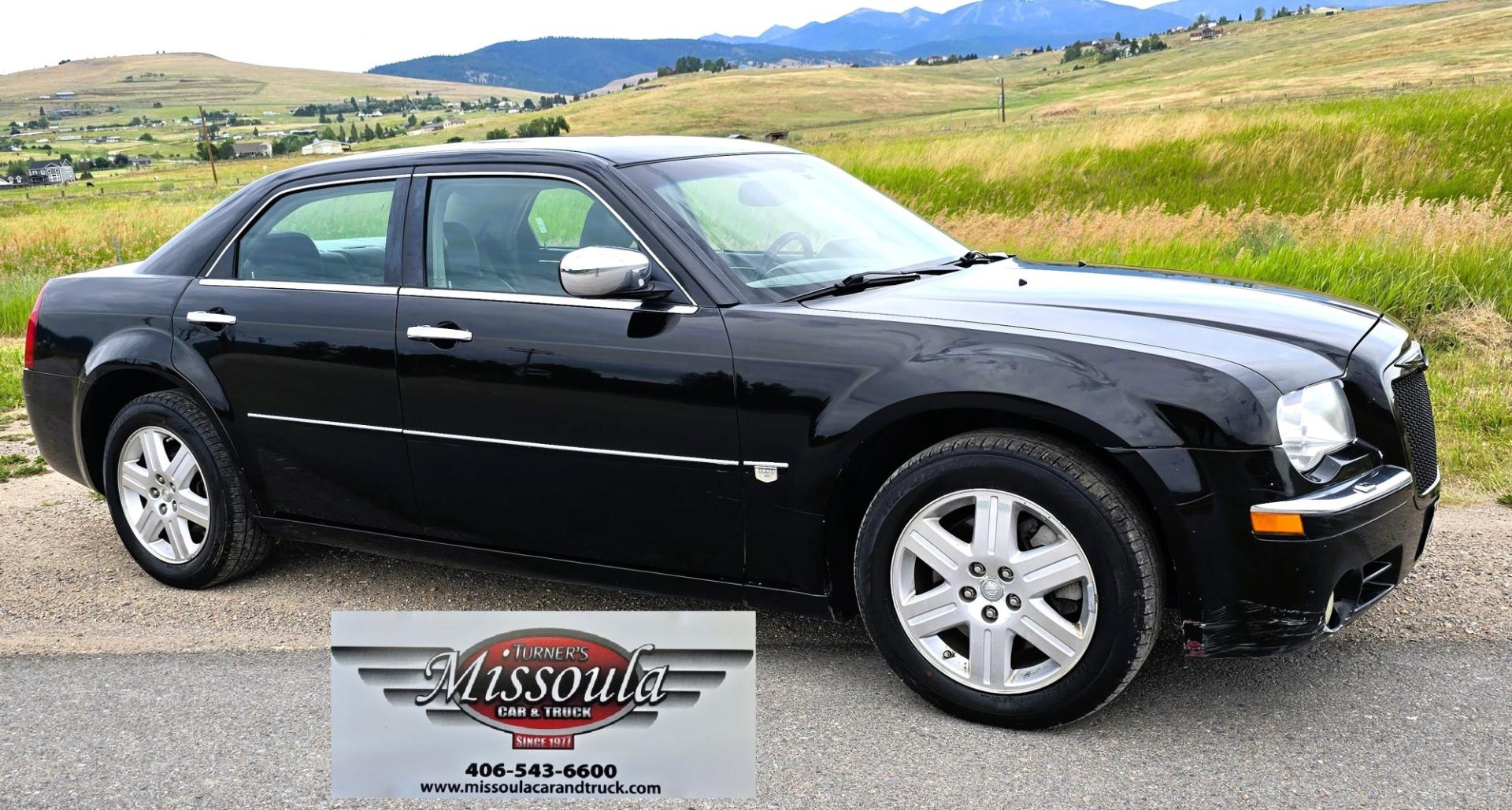 2006 Black /Black Chrysler 300 C AWD (2C3KK63H36H) with an 5.7L V8 OHV 16V engine, 5A OD transmission, located at 450 N Russell, Missoula, MT, 59801, (406) 543-6600, 46.874496, -114.017433 - Tons of Power with a 5.7L V8 Hemi Engine. Comfortable to drive. 5 Speed Automatic Overdrive Transmission. AWD. Heated Power Front Seats. Air Conditioning. CRusie Control. Power Windows and Locks. Aftermarket Touch Screen Stereo. Because oft he age of this vehicle, our lenders do NOT offer finan- Photo#7