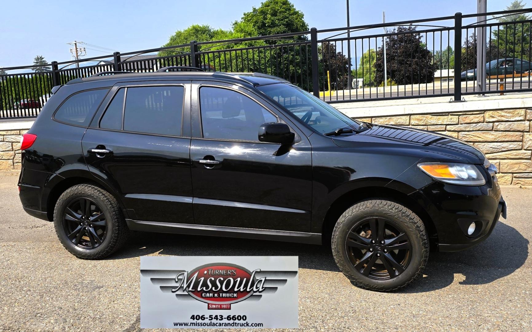 2012 Black /Black Hyundai Santa Fe Limited 3.5 4WD (5XYZKDAG4CG) with an 3.5L V6 DOHC 24V engine, 6-Speed Automatic transmission, located at 450 N Russell, Missoula, MT, 59801, (406) 543-6600, 46.874496, -114.017433 - Zippy AWD SUV. 3.5L V6 really Gets Up and Goes. The All Wheel Drive is perfect for Montana Winters. Power Windows and Locks. Air Conditioning that was just recently serviced. Heated Front Seats. Infinity Stereo System with AM FM XM Aux and CD Player. Bluetooth Audio and Phone. Steering Wheel Control- Photo#1