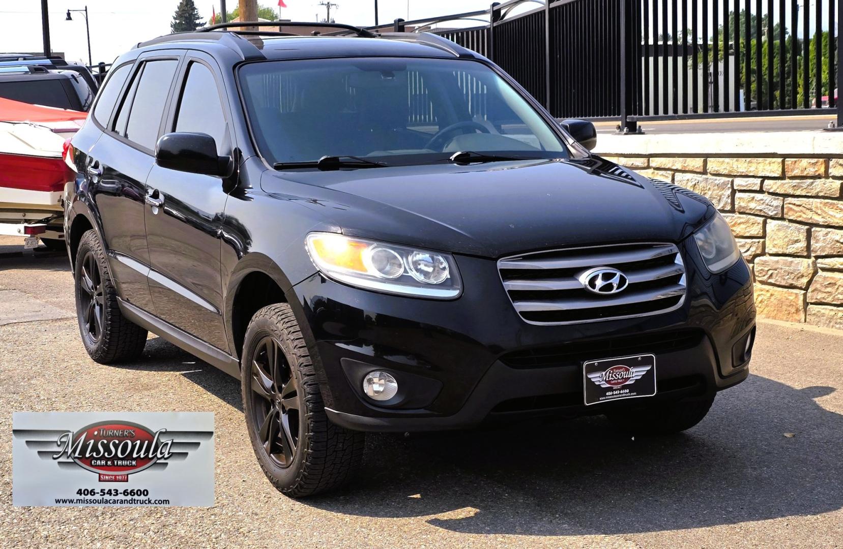 2012 Black /Black Hyundai Santa Fe Limited 3.5 4WD (5XYZKDAG4CG) with an 3.5L V6 DOHC 24V engine, 6-Speed Automatic transmission, located at 450 N Russell, Missoula, MT, 59801, (406) 543-6600, 46.874496, -114.017433 - Zippy AWD SUV. 3.5L V6 really Gets Up and Goes. The All Wheel Drive is perfect for Montana Winters. Power Windows and Locks. Air Conditioning that was just recently serviced. Heated Front Seats. Infinity Stereo System with AM FM XM Aux and CD Player. Bluetooth Audio and Phone. Steering Wheel Control- Photo#3