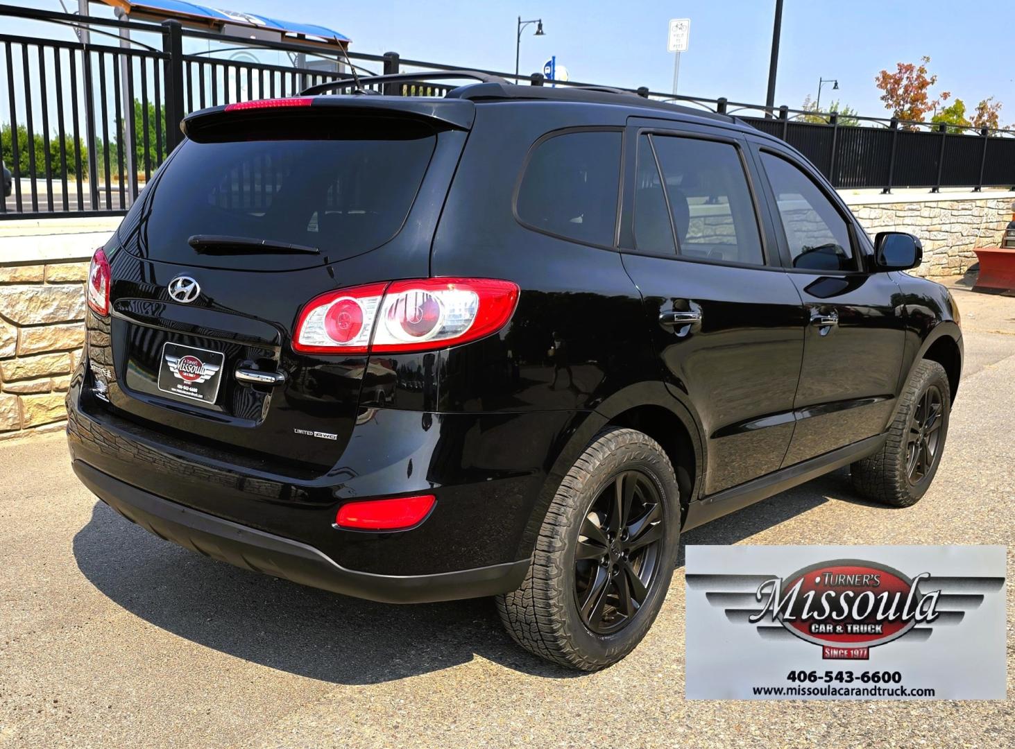 2012 Black /Black Hyundai Santa Fe Limited 3.5 4WD (5XYZKDAG4CG) with an 3.5L V6 DOHC 24V engine, 6-Speed Automatic transmission, located at 450 N Russell, Missoula, MT, 59801, (406) 543-6600, 46.874496, -114.017433 - Zippy AWD SUV. 3.5L V6 really Gets Up and Goes. The All Wheel Drive is perfect for Montana Winters. Power Windows and Locks. Air Conditioning that was just recently serviced. Heated Front Seats. Infinity Stereo System with AM FM XM Aux and CD Player. Bluetooth Audio and Phone. Steering Wheel Control- Photo#4