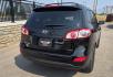 2012 Black /Black Hyundai Santa Fe Limited 3.5 4WD (5XYZKDAG4CG) with an 3.5L V6 DOHC 24V engine, 6-Speed Automatic transmission, located at 450 N Russell, Missoula, MT, 59801, (406) 543-6600, 46.874496, -114.017433 - Zippy AWD SUV. 3.5L V6 really Gets Up and Goes. The All Wheel Drive is perfect for Montana Winters. Power Windows and Locks. Air Conditioning that was just recently serviced. Heated Front Seats. Infinity Stereo System with AM FM XM Aux and CD Player. Bluetooth Audio and Phone. Steering Wheel Control- Photo#5
