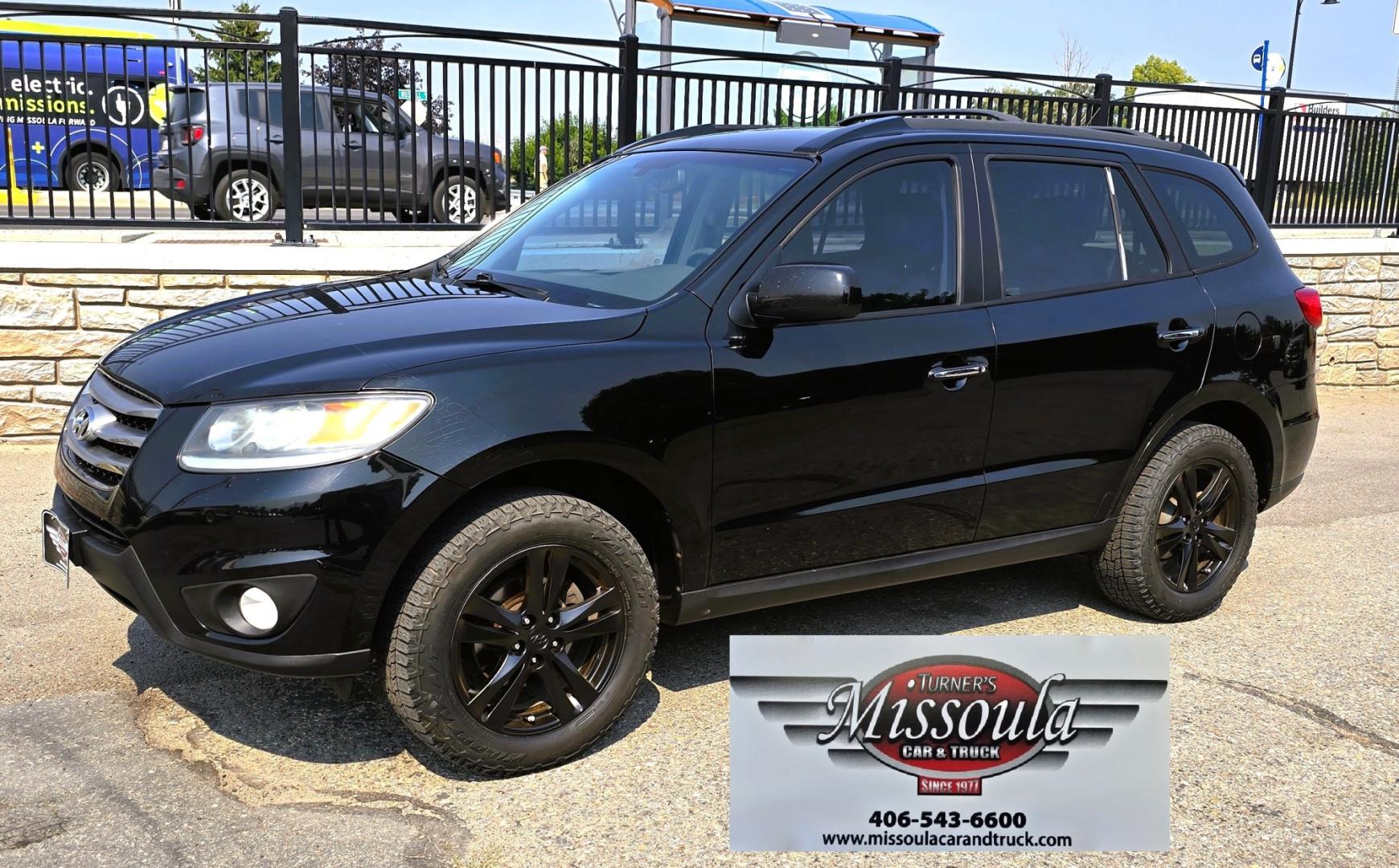 2012 Black /Black Hyundai Santa Fe Limited 3.5 4WD (5XYZKDAG4CG) with an 3.5L V6 DOHC 24V engine, 6-Speed Automatic transmission, located at 450 N Russell, Missoula, MT, 59801, (406) 543-6600, 46.874496, -114.017433 - Zippy AWD SUV. 3.5L V6 really Gets Up and Goes. The All Wheel Drive is perfect for Montana Winters. Power Windows and Locks. Air Conditioning that was just recently serviced. Heated Front Seats. Infinity Stereo System with AM FM XM Aux and CD Player. Bluetooth Audio and Phone. Steering Wheel Control- Photo#7