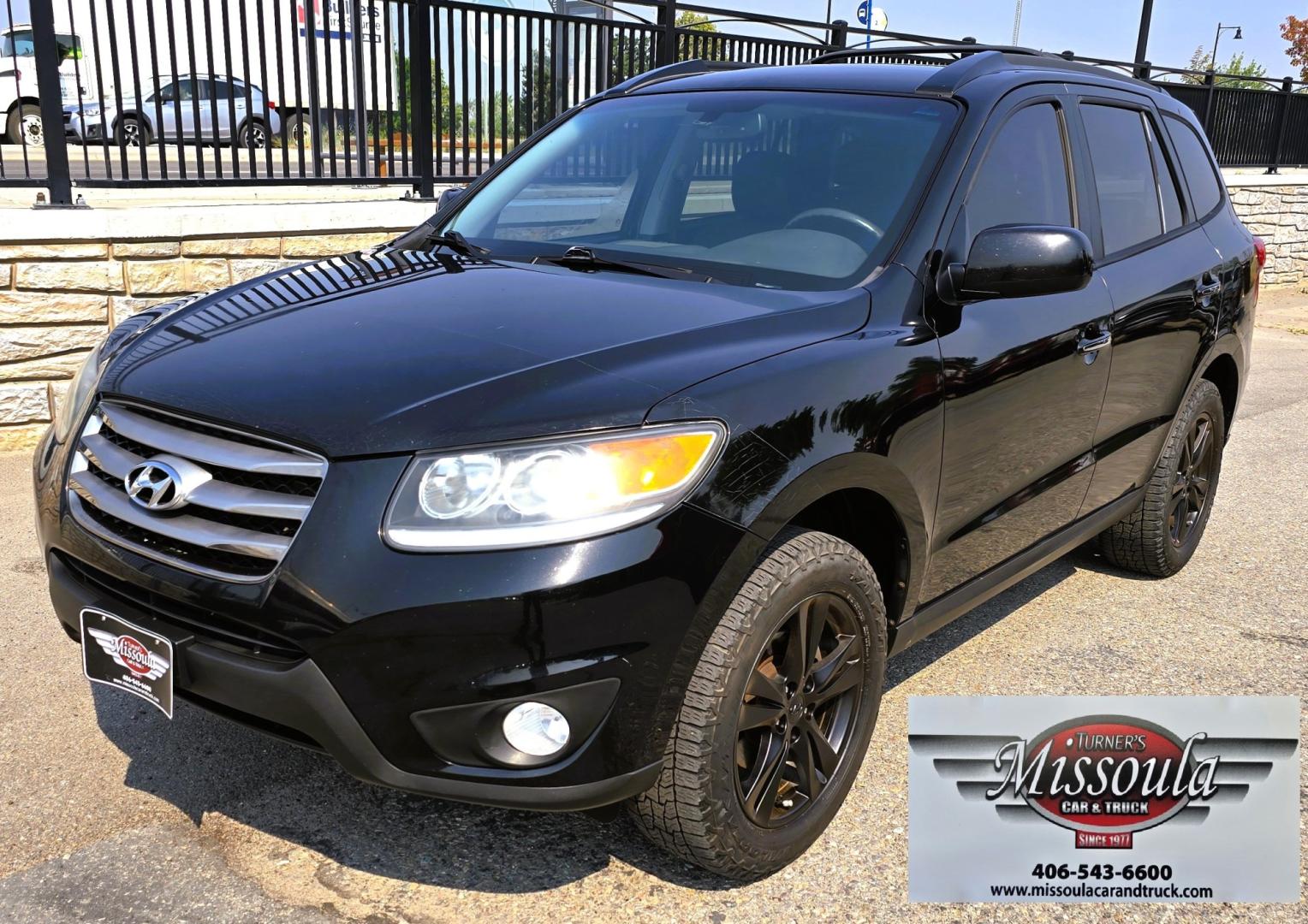 2012 Black /Black Hyundai Santa Fe Limited 3.5 4WD (5XYZKDAG4CG) with an 3.5L V6 DOHC 24V engine, 6-Speed Automatic transmission, located at 450 N Russell, Missoula, MT, 59801, (406) 543-6600, 46.874496, -114.017433 - Zippy AWD SUV. 3.5L V6 really Gets Up and Goes. The All Wheel Drive is perfect for Montana Winters. Power Windows and Locks. Air Conditioning that was just recently serviced. Heated Front Seats. Infinity Stereo System with AM FM XM Aux and CD Player. Bluetooth Audio and Phone. Steering Wheel Control- Photo#8