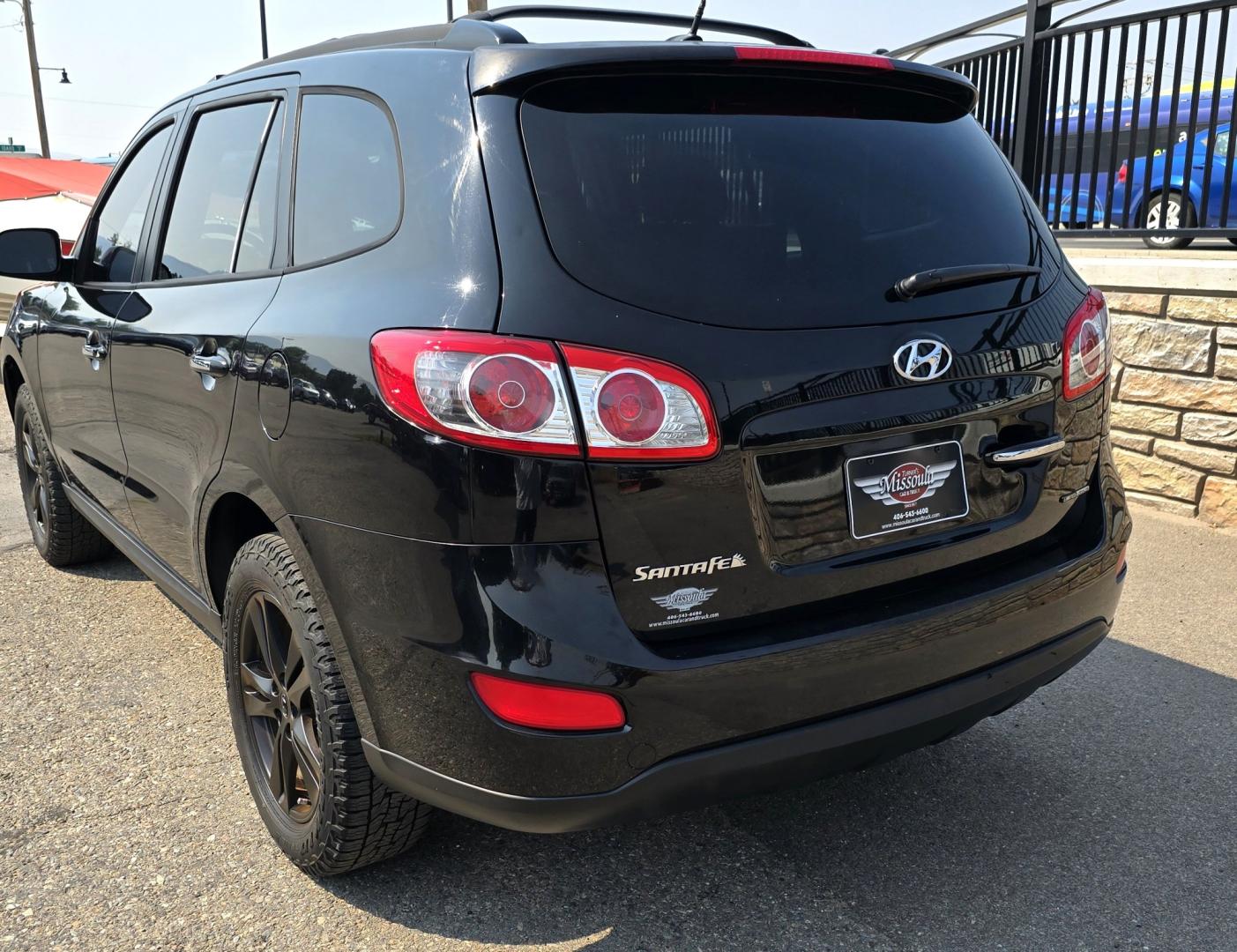 2012 Black /Black Hyundai Santa Fe Limited 3.5 4WD (5XYZKDAG4CG) with an 3.5L V6 DOHC 24V engine, 6-Speed Automatic transmission, located at 450 N Russell, Missoula, MT, 59801, (406) 543-6600, 46.874496, -114.017433 - Zippy AWD SUV. 3.5L V6 really Gets Up and Goes. The All Wheel Drive is perfect for Montana Winters. Power Windows and Locks. Air Conditioning that was just recently serviced. Heated Front Seats. Infinity Stereo System with AM FM XM Aux and CD Player. Bluetooth Audio and Phone. Steering Wheel Control- Photo#10