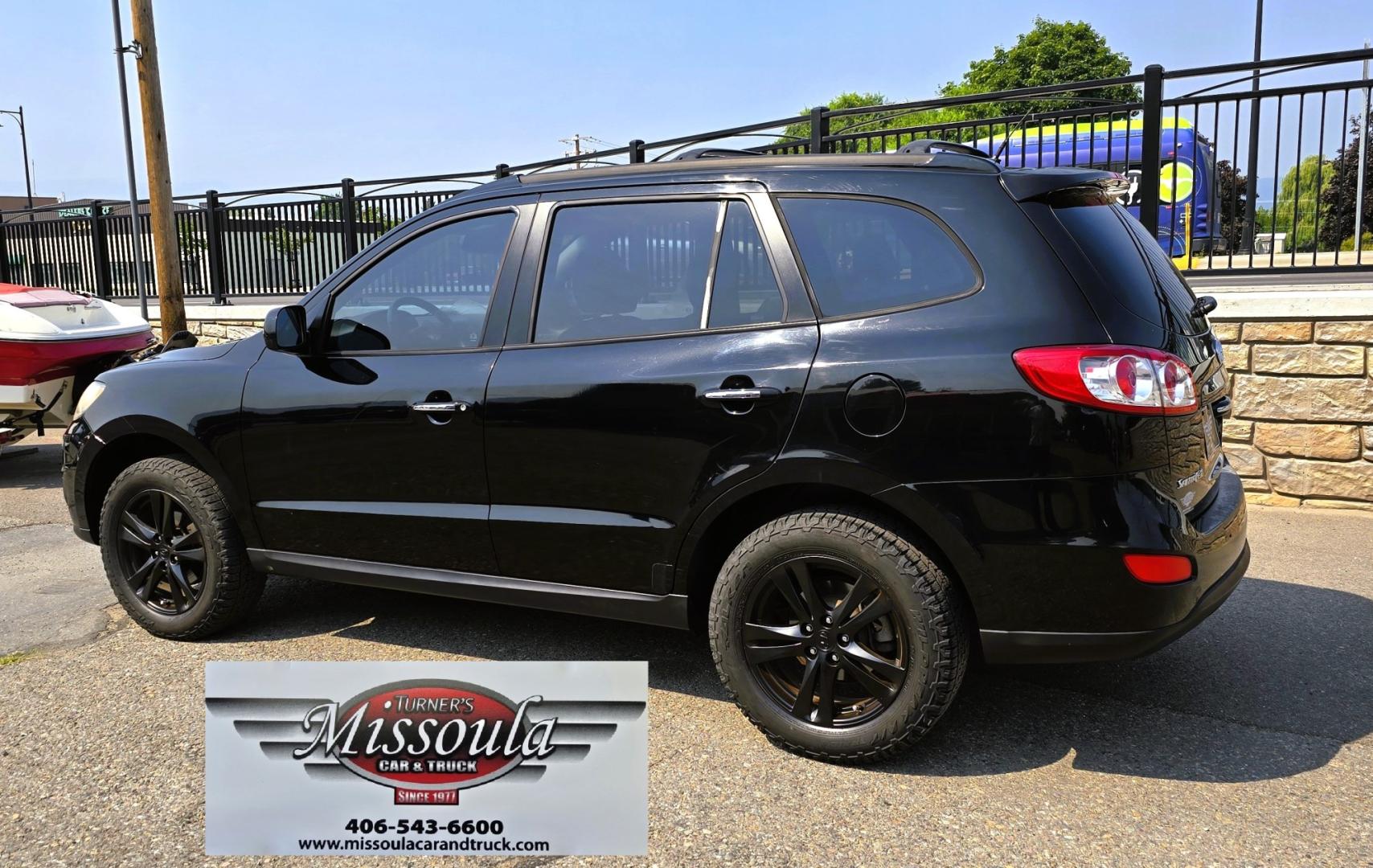2012 Black /Black Hyundai Santa Fe Limited 3.5 4WD (5XYZKDAG4CG) with an 3.5L V6 DOHC 24V engine, 6-Speed Automatic transmission, located at 450 N Russell, Missoula, MT, 59801, (406) 543-6600, 46.874496, -114.017433 - Zippy AWD SUV. 3.5L V6 really Gets Up and Goes. The All Wheel Drive is perfect for Montana Winters. Power Windows and Locks. Air Conditioning that was just recently serviced. Heated Front Seats. Infinity Stereo System with AM FM XM Aux and CD Player. Bluetooth Audio and Phone. Steering Wheel Control- Photo#9