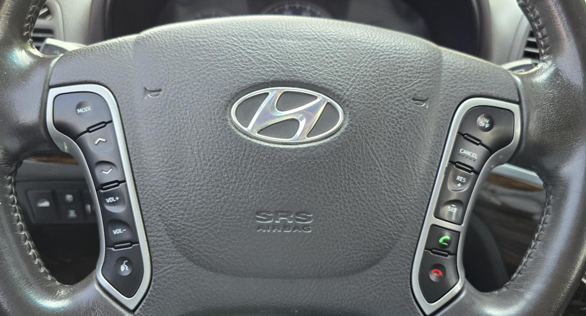 2012 Black /Black Hyundai Santa Fe Limited 3.5 4WD (5XYZKDAG4CG) with an 3.5L V6 DOHC 24V engine, 6-Speed Automatic transmission, located at 450 N Russell, Missoula, MT, 59801, (406) 543-6600, 46.874496, -114.017433 - Zippy AWD SUV. 3.5L V6 really Gets Up and Goes. The All Wheel Drive is perfect for Montana Winters. Power Windows and Locks. Air Conditioning that was just recently serviced. Heated Front Seats. Infinity Stereo System with AM FM XM Aux and CD Player. Bluetooth Audio and Phone. Steering Wheel Control- Photo#11