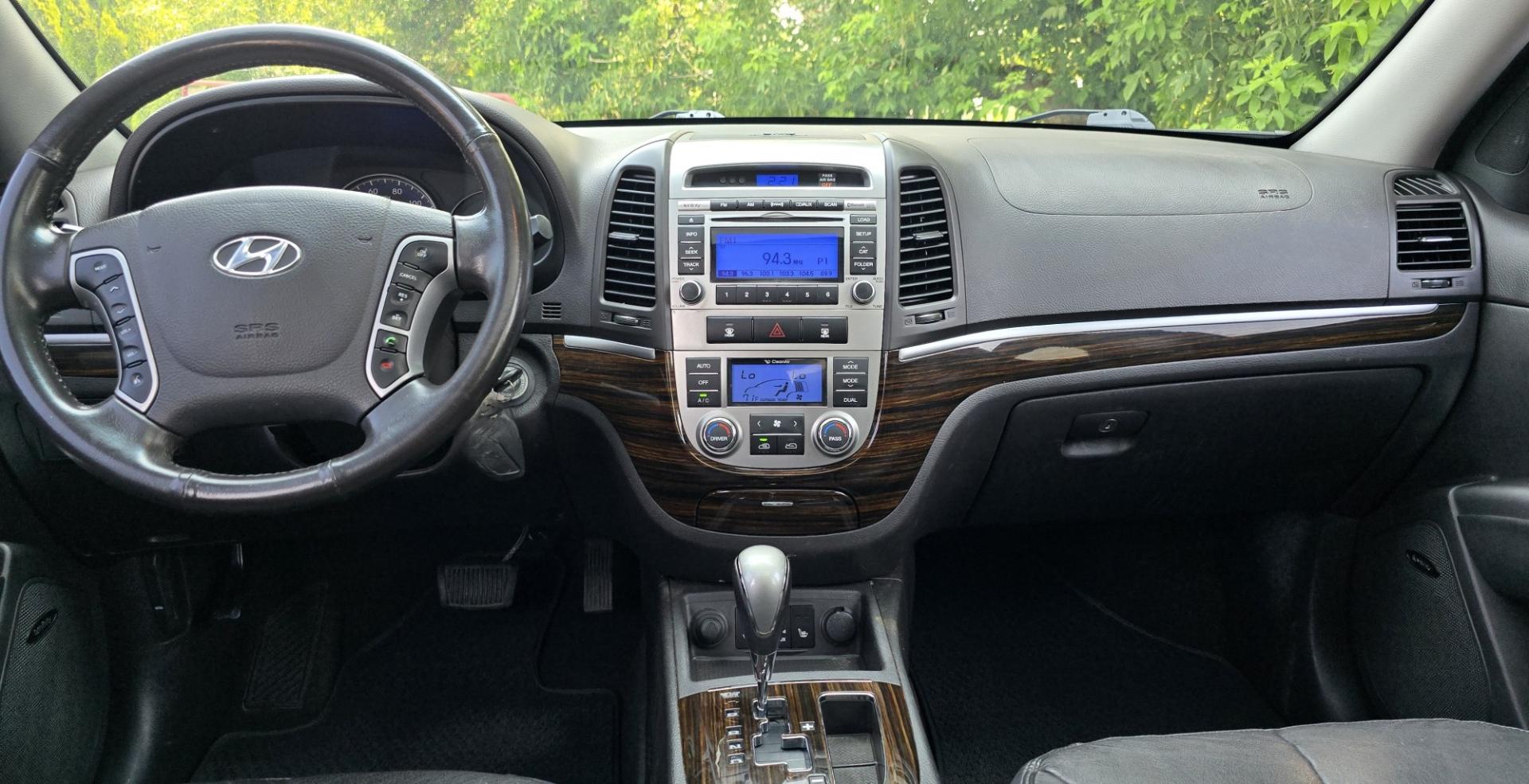 2012 Black /Black Hyundai Santa Fe Limited 3.5 4WD (5XYZKDAG4CG) with an 3.5L V6 DOHC 24V engine, 6-Speed Automatic transmission, located at 450 N Russell, Missoula, MT, 59801, (406) 543-6600, 46.874496, -114.017433 - Zippy AWD SUV. 3.5L V6 really Gets Up and Goes. The All Wheel Drive is perfect for Montana Winters. Power Windows and Locks. Air Conditioning that was just recently serviced. Heated Front Seats. Infinity Stereo System with AM FM XM Aux and CD Player. Bluetooth Audio and Phone. Steering Wheel Control- Photo#17