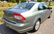 2008 Green /Tan Mercury Milan V6 Premier AWD (3MEHM02148R) with an 3.0L V6 DOHC 24V engine, 6A OD transmission, located at 450 N Russell, Missoula, MT, 59801, (406) 543-6600, 46.874496, -114.017433 - Only 94k Miles! You read that right. Classy looking AWD Sedan. 3.0L V6 Engine. 6 Speed Automatic Overdrive Transmission. Air Conditioning that was just serviced. AM FM 6 CD Changer. Bluetooth Phone Connection. Leather Seats.- Photo#3