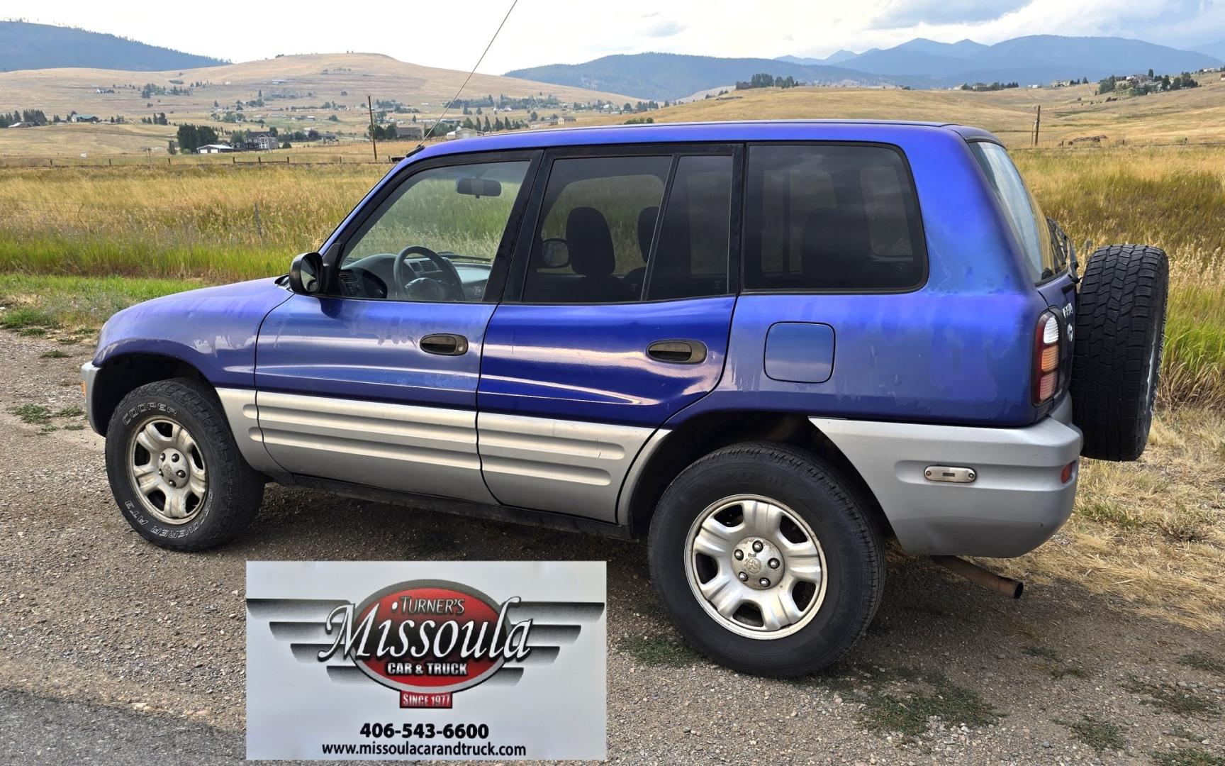 2000 Blue /Blue Toyota RAV4 4-Door 2WD (JT3GP10V0Y0) with an 2.0L L4 DOHC 16V engine, Automatic transmission, located at 450 N Russell, Missoula, MT, 59801, (406) 543-6600, 46.874496, -114.017433 - Great Running Toyota with an impeccable CarFax. 2.0L I4 Engine with a New Timing Belt. Head Gasket and Water Pump less than 10k miles ago. Automatic Transmissions shifts smooth. Air Blows Cold. Has an Aftermarket CD Player. Power Windows and Locks. Has a clean Title and Carfax. The only drawback is- Photo#2