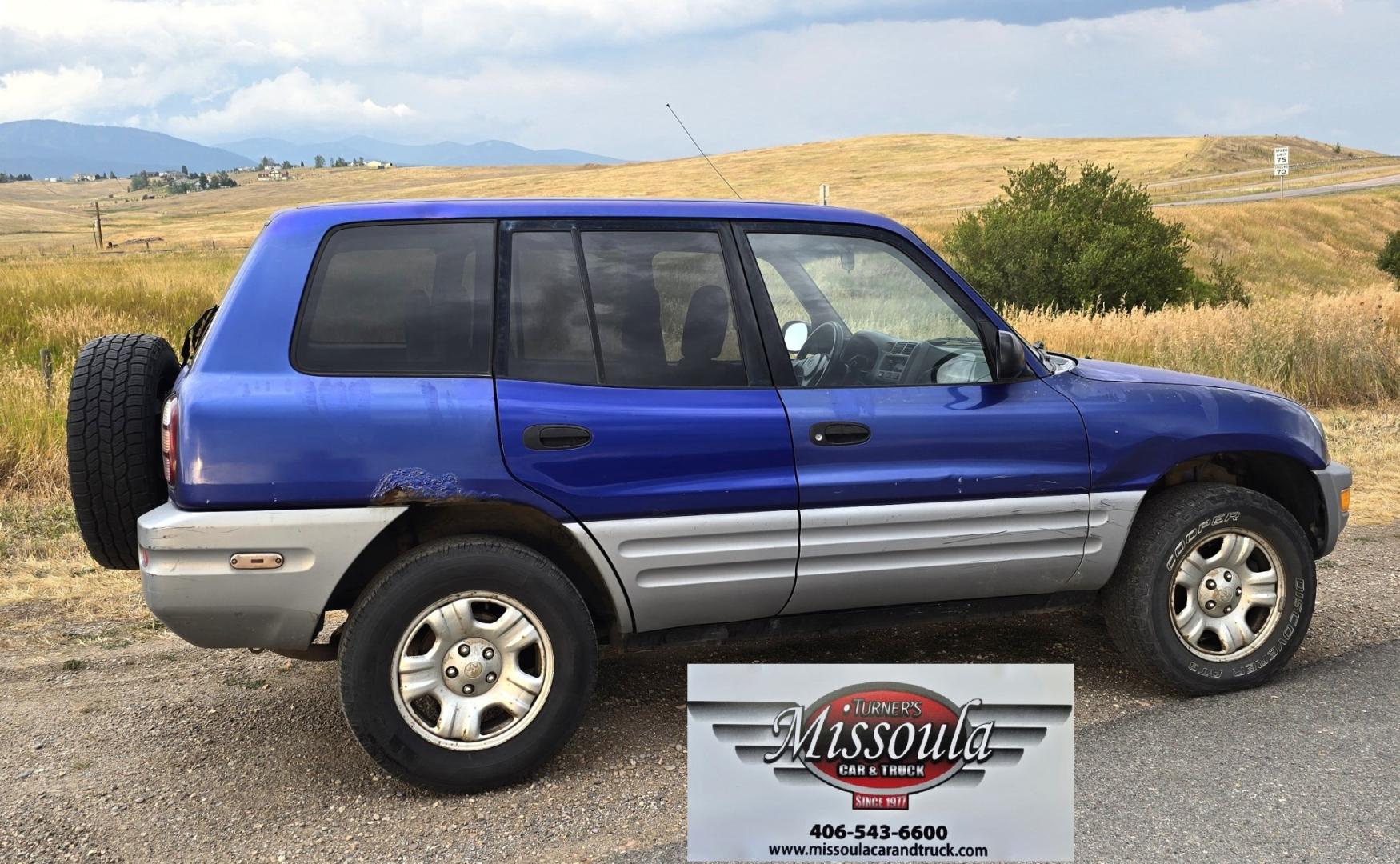 2000 Blue /Blue Toyota RAV4 4-Door 2WD (JT3GP10V0Y0) with an 2.0L L4 DOHC 16V engine, Automatic transmission, located at 450 N Russell, Missoula, MT, 59801, (406) 543-6600, 46.874496, -114.017433 - Great Running Toyota with an impeccable CarFax. 2.0L I4 Engine with a New Timing Belt. Head Gasket and Water Pump less than 10k miles ago. Automatic Transmissions shifts smooth. Air Blows Cold. Has an Aftermarket CD Player. Power Windows and Locks. Has a clean Title and Carfax. The only drawback is- Photo#5