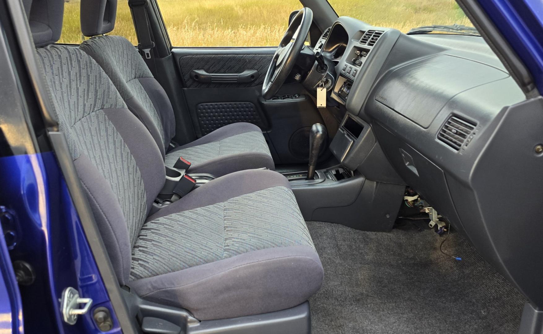 2000 Blue /Blue Toyota RAV4 4-Door 2WD (JT3GP10V0Y0) with an 2.0L L4 DOHC 16V engine, Automatic transmission, located at 450 N Russell, Missoula, MT, 59801, (406) 543-6600, 46.874496, -114.017433 - Great Running Toyota with an impeccable CarFax. 2.0L I4 Engine with a New Timing Belt. Head Gasket and Water Pump less than 10k miles ago. Automatic Transmissions shifts smooth. Air Blows Cold. Has an Aftermarket CD Player. Power Windows and Locks. Has a clean Title and Carfax. The only drawback is- Photo#8
