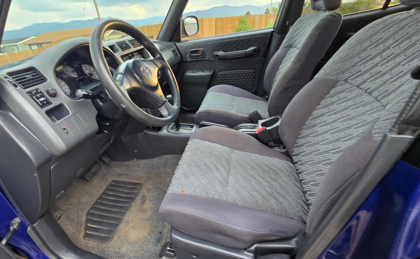 2000 Blue /Blue Toyota RAV4 4-Door 2WD (JT3GP10V0Y0) with an 2.0L L4 DOHC 16V engine, Automatic transmission, located at 450 N Russell, Missoula, MT, 59801, (406) 543-6600, 46.874496, -114.017433 - Great Running Toyota with an impeccable CarFax. 2.0L I4 Engine with a New Timing Belt. Head Gasket and Water Pump less than 10k miles ago. Automatic Transmissions shifts smooth. Air Blows Cold. Has an Aftermarket CD Player. Power Windows and Locks. Has a clean Title and Carfax. The only drawback is- Photo#12