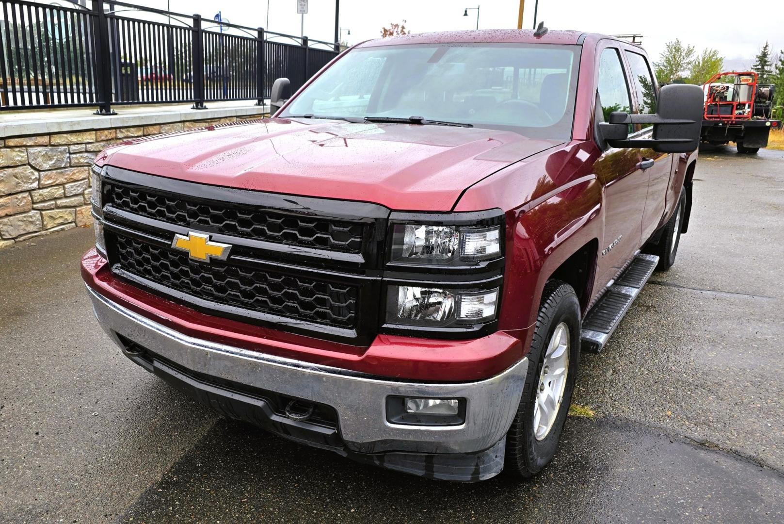 2014 Maroon /Gray Chevrolet Silverado 1500 1LT Crew Cab 4WD (3GCUKREH9EG) with an 4.3L V6 OHV 12V engine, 6-Speed Automatic transmission, located at 450 N Russell, Missoula, MT, 59801, (406) 543-6600, 46.874496, -114.017433 - Sharp Silverado 4WD. Economical 4.V6 Engine. Automatic Transmission. Air. Cruise. Tilt. Power Windows and Locks. Backup Camera. AM FM CD Player. Bluetooth Audio and Phone Connection. Front Seats are Power and Heated. Running Board. Paint has some scratches.- Photo#5