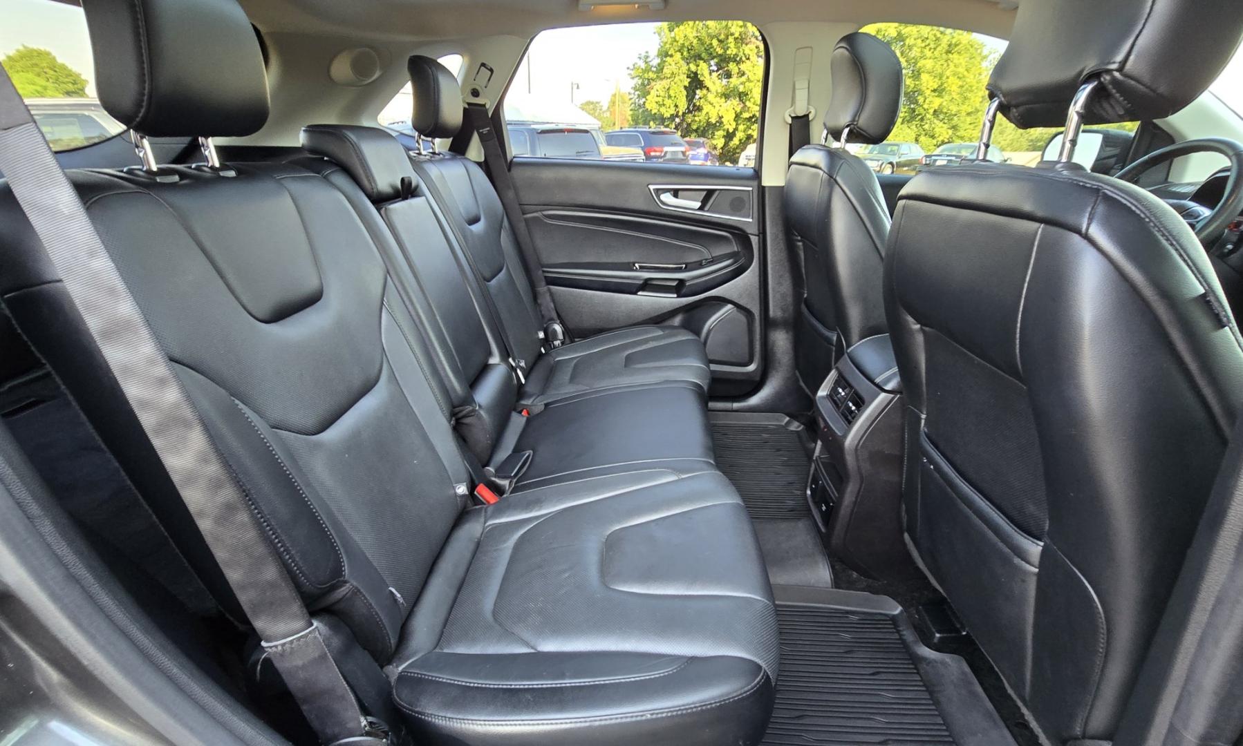 2017 Charcoal /Black Ford Edge Titanium AWD (2FMPK4K92HB) with an 2.0L L4 DOHC 16V engine, 6A transmission, located at 450 N Russell, Missoula, MT, 59801, (406) 543-6600, 46.874496, -114.017433 - One of the Nicest Used Vehicles in Missoula. One Owner. Only 85K Miles on the 2.0L I4 Engine. 6 Speed Automatic Transmission. All Wheel Drive. Huge Panoramic Sunroof. Leather Interior. Front Power Seats that are both Heated and Cooled. Rear Seats are Heated. Heated Steering Wheel. Navigation. Adapti- Photo#12