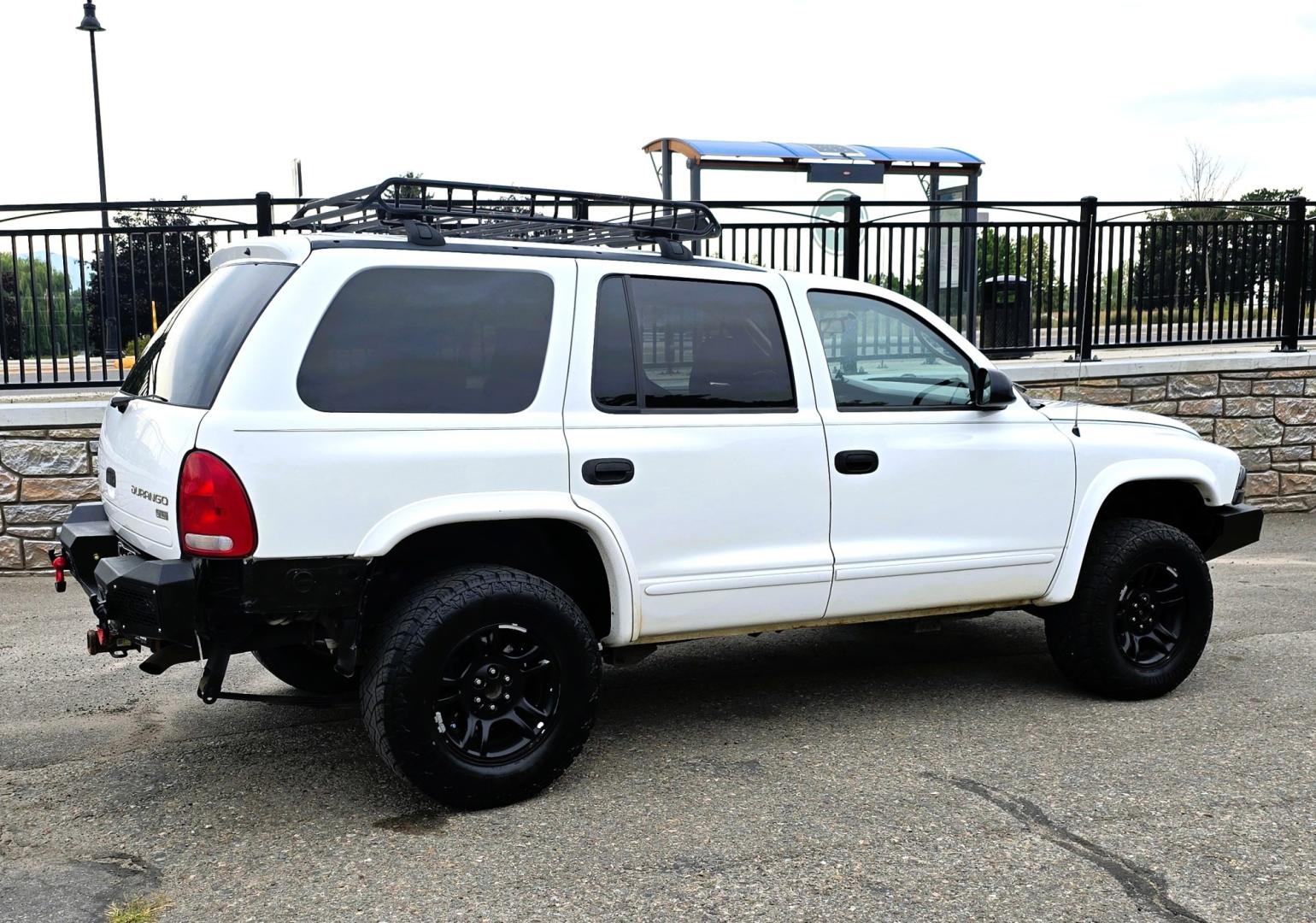 2003 White /Black Dodge Durango SLT 4WD (1D4HS48N03F) with an 4.7L V8 SOHC 16V engine, located at 450 N Russell, Missoula, MT, 59801, (406) 543-6600, 46.874496, -114.017433 - Ready to Go Four Wheeling! Excellent Running 4WD SUV. 4.7L V8 Engine. Automatic Transmission. Aftermarket Front and rear Bumper. Racing Front Seats. 3rd Row Seating. Aftermarket Stereo with Add On Touch Screen. Bluetooth. Air Conditioning. Power Windows and Locks.- Photo#2