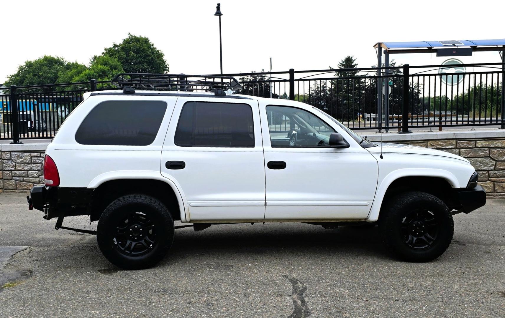 2003 White /Black Dodge Durango SLT 4WD (1D4HS48N03F) with an 4.7L V8 SOHC 16V engine, located at 450 N Russell, Missoula, MT, 59801, (406) 543-6600, 46.874496, -114.017433 - Ready to Go Four Wheeling! Excellent Running 4WD SUV. 4.7L V8 Engine. Automatic Transmission. Aftermarket Front and rear Bumper. Racing Front Seats. 3rd Row Seating. Aftermarket Stereo with Add On Touch Screen. Bluetooth. Air Conditioning. Power Windows and Locks.- Photo#1