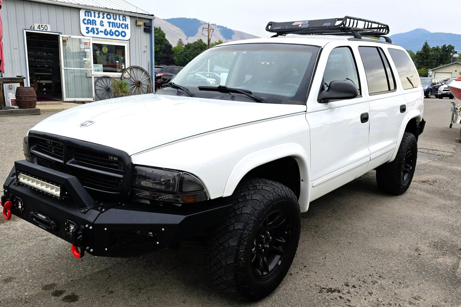 2003 White /Black Dodge Durango SLT 4WD (1D4HS48N03F) with an 4.7L V8 SOHC 16V engine, located at 450 N Russell, Missoula, MT, 59801, (406) 543-6600, 46.874496, -114.017433 - Ready to Go Four Wheeling! Excellent Running 4WD SUV. 4.7L V8 Engine. Automatic Transmission. Aftermarket Front and rear Bumper. Racing Front Seats. 3rd Row Seating. Aftermarket Stereo with Add On Touch Screen. Bluetooth. Air Conditioning. Power Windows and Locks.- Photo#4